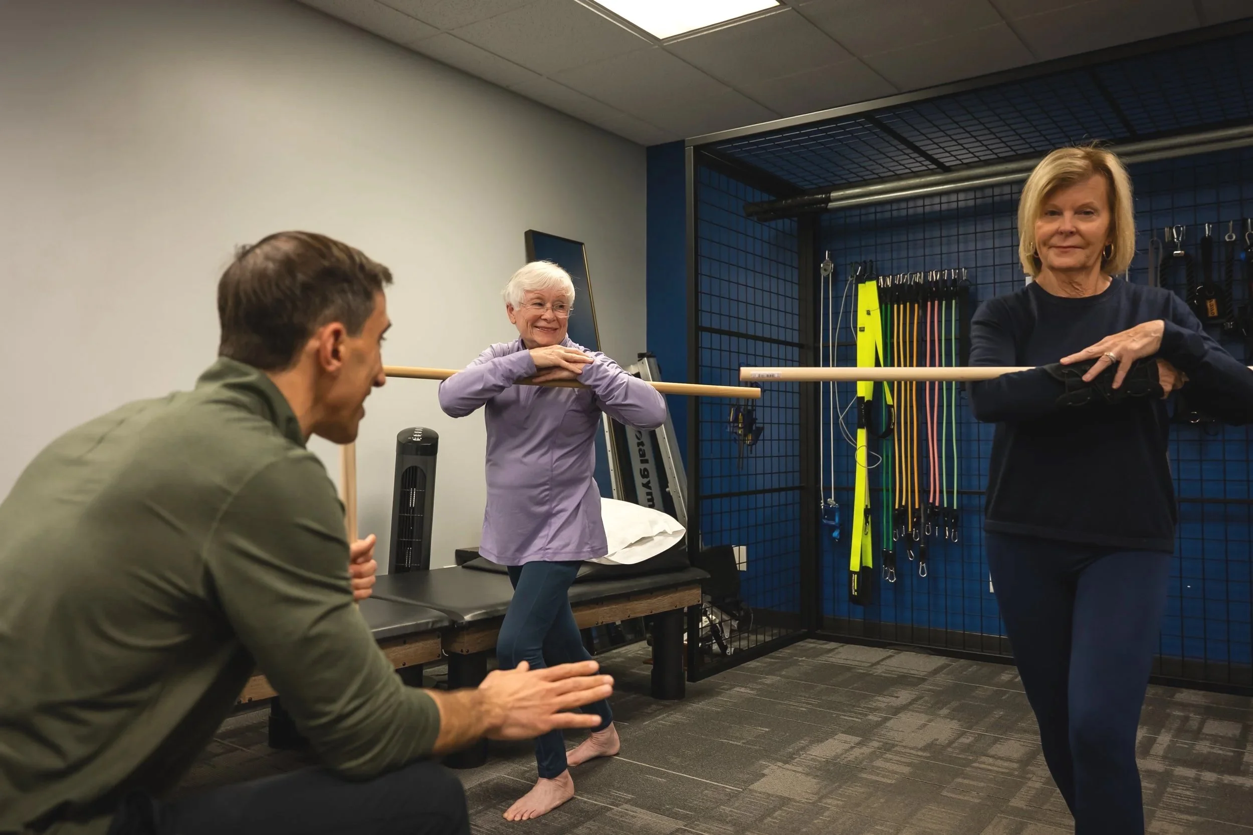 Two adults doing balance exercises