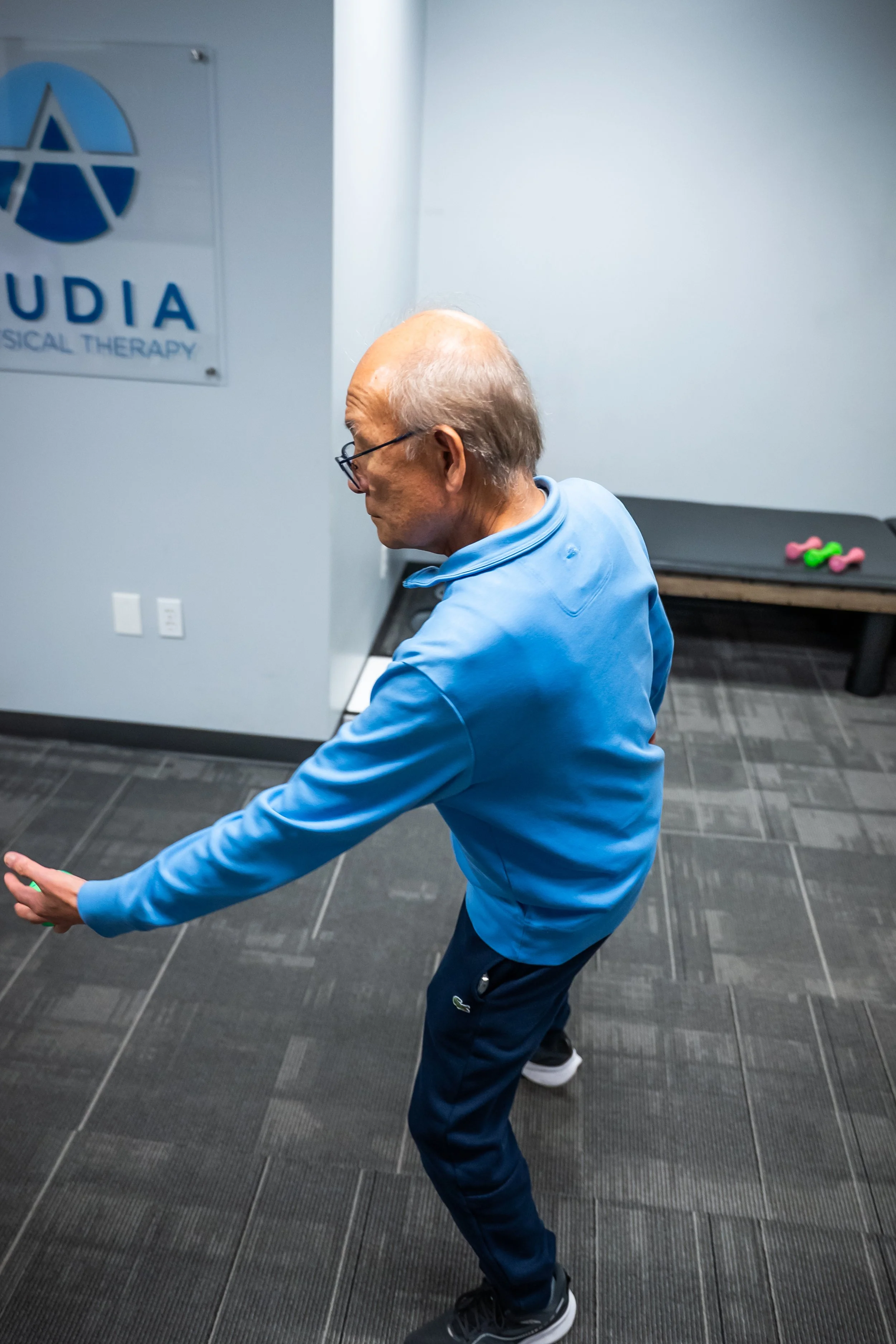 Older adult doing balance exercises