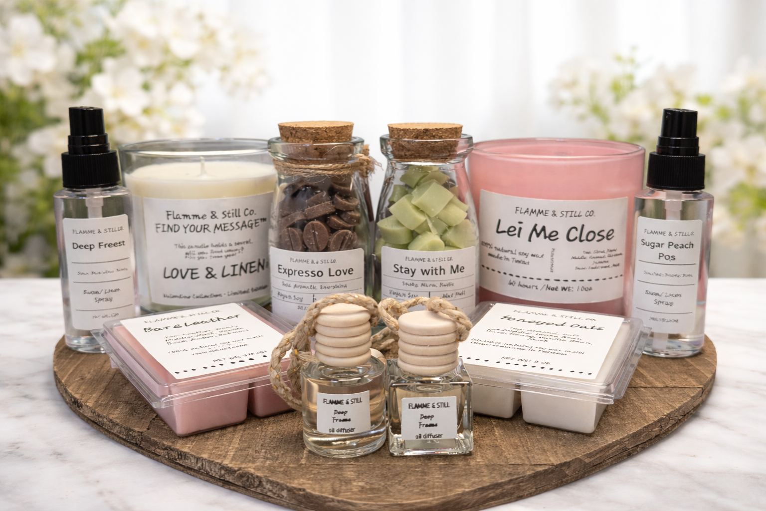 A collection of candles, wax melts, room sprays, and essential oils arranged on a wooden board. Includes a pink candle labeled 'Lei Me Close,' green and brown wax melts in jars, and small perfume bottles.