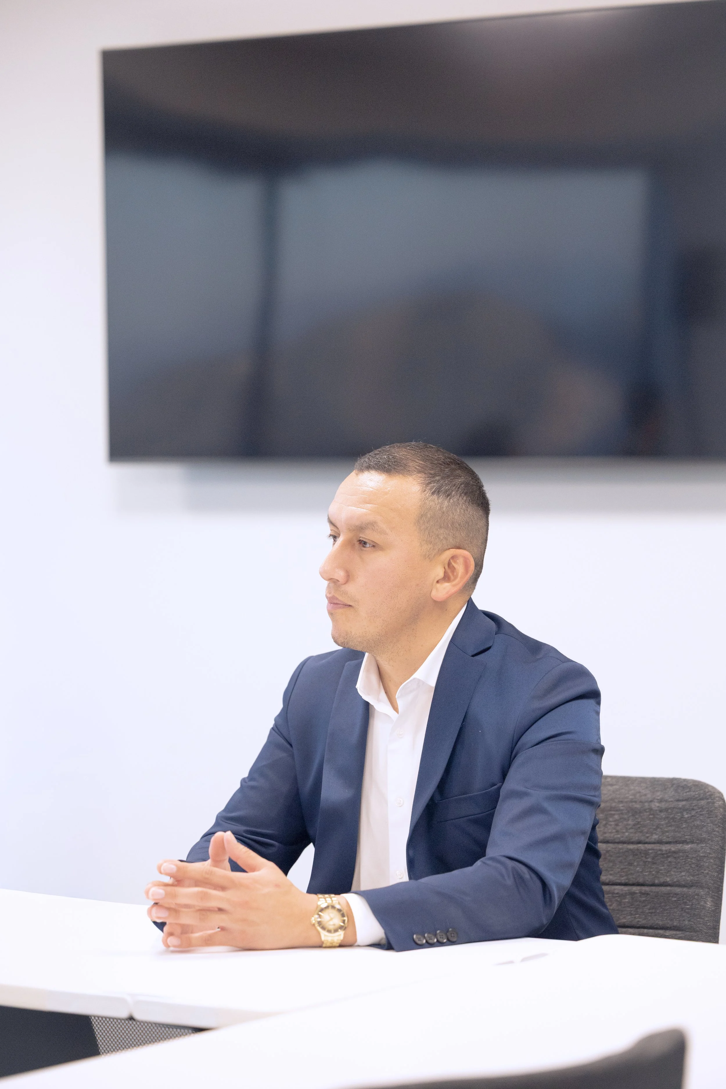 Pedro Gomez in a strategy meeting setting, focused on partnerships and project execution in Seattle