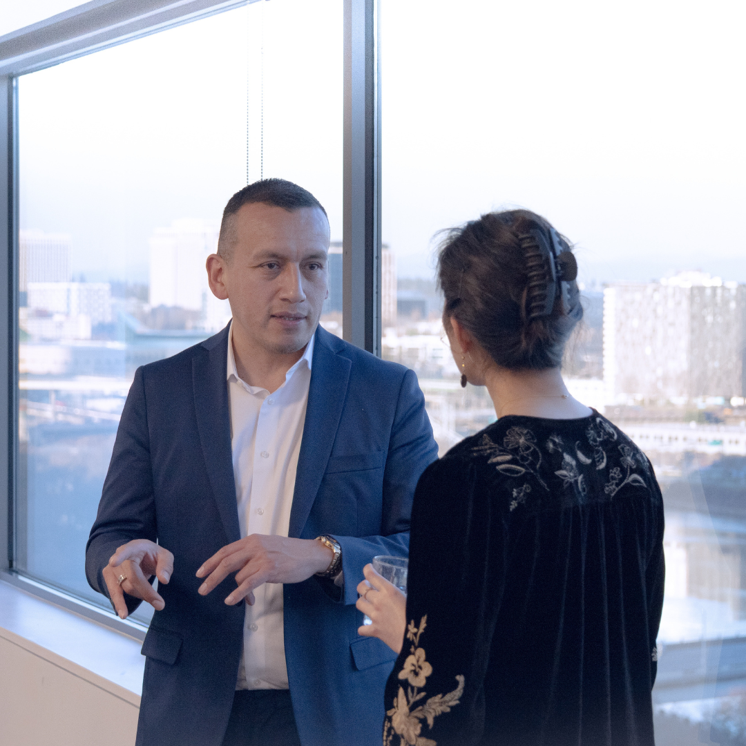 Pedro Gomez in conversation with a community leader on collaboration and local impact