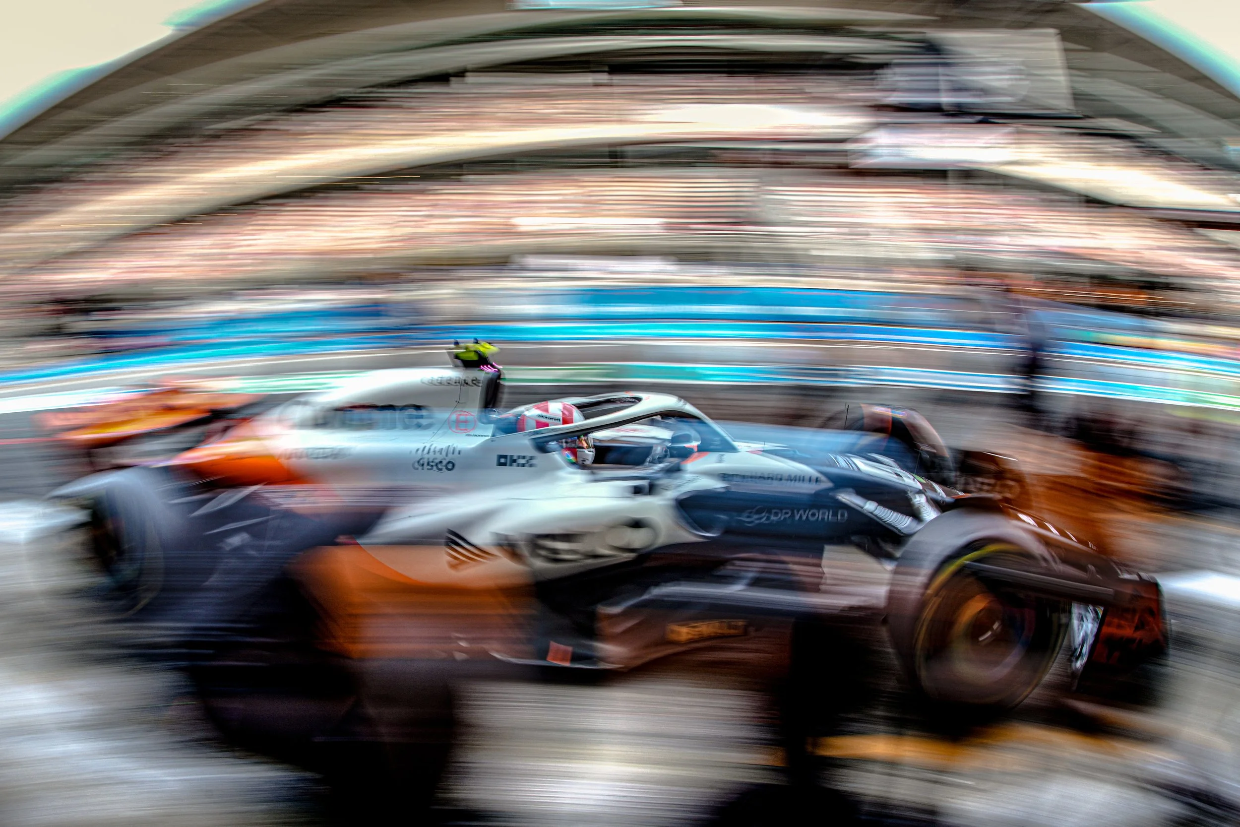 Speeding Formula 1 car in a race with motion blur.