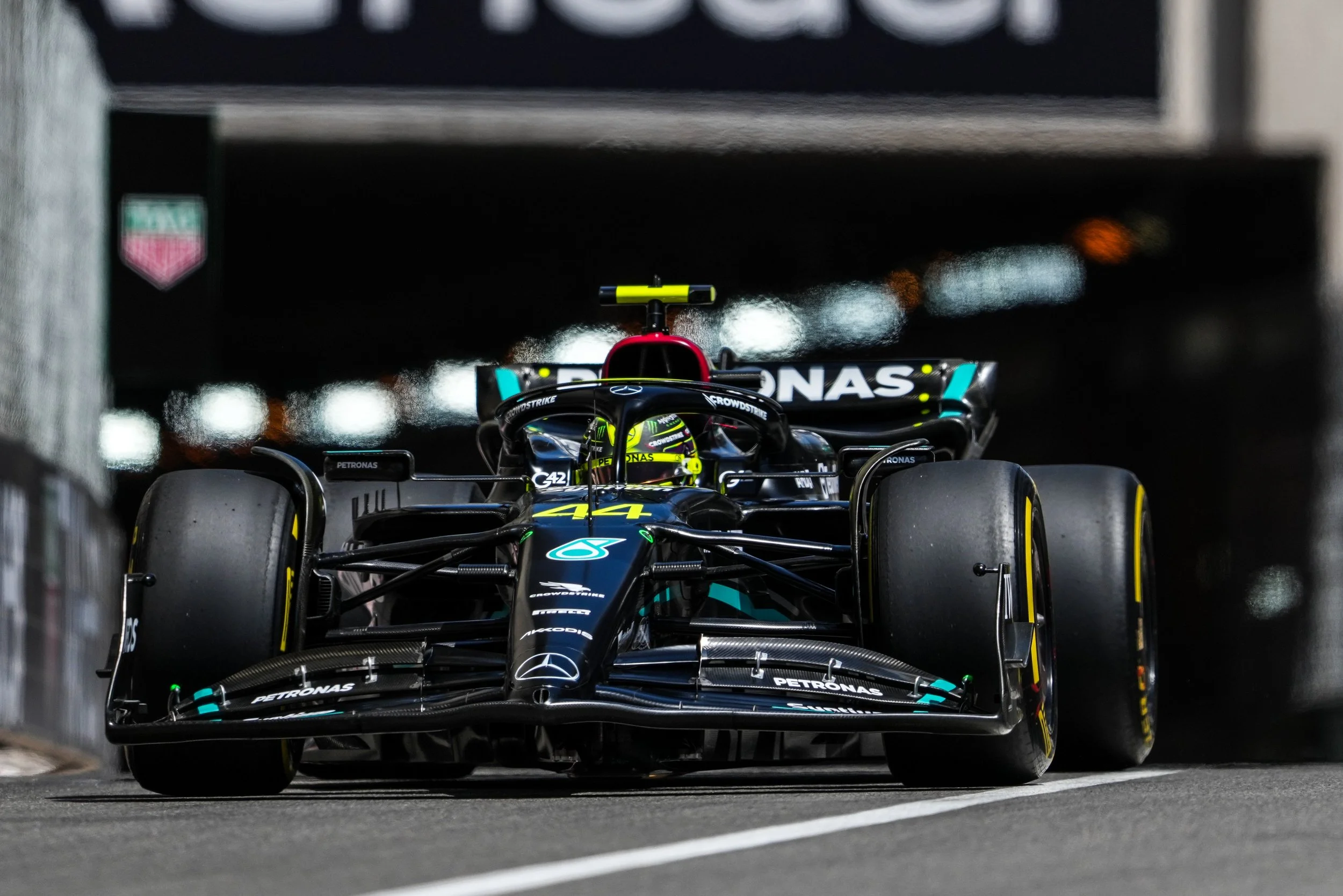 A Formula 1 Lewis Hamilton, and features the Mercedes-AMG Petronas Formula One Team branding.