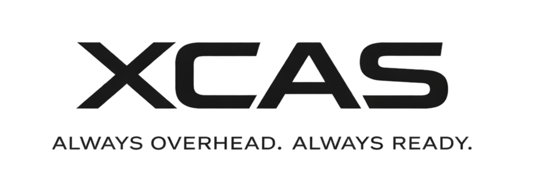 A logo with the word "XCASE," featuring a stylized red letter 'S' and the tagline "Always Overhead. Always Ready."