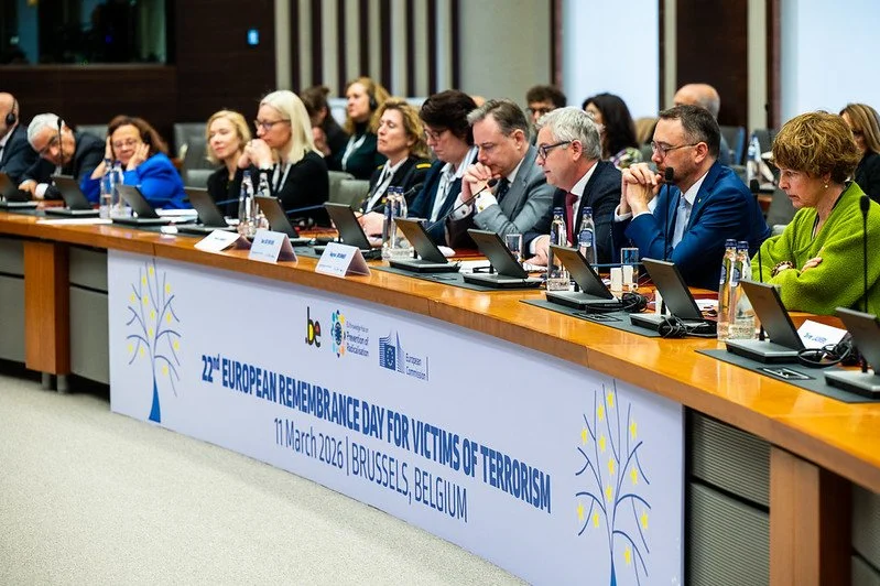 Group of people sitting at a long conference table during the 22nd European Remembrance Day for Victims of Terrorism on March 11, 2026, in Brussels, Belgium.