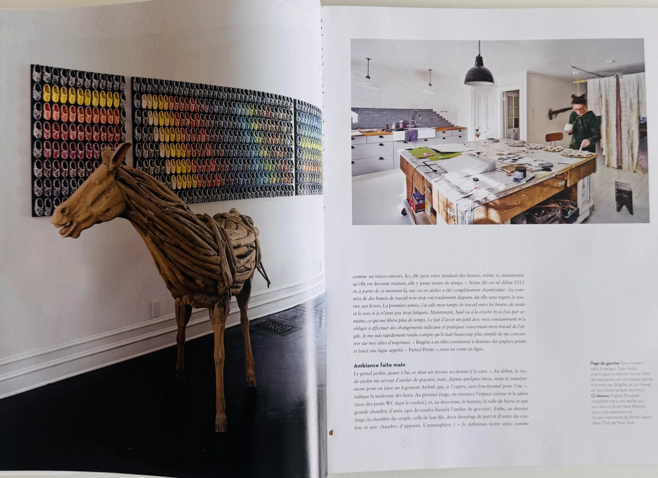 Open magazine showing a wooden horse sculpture on the left page and a photo of a kitchen with a person baking on the right page, with text below.
