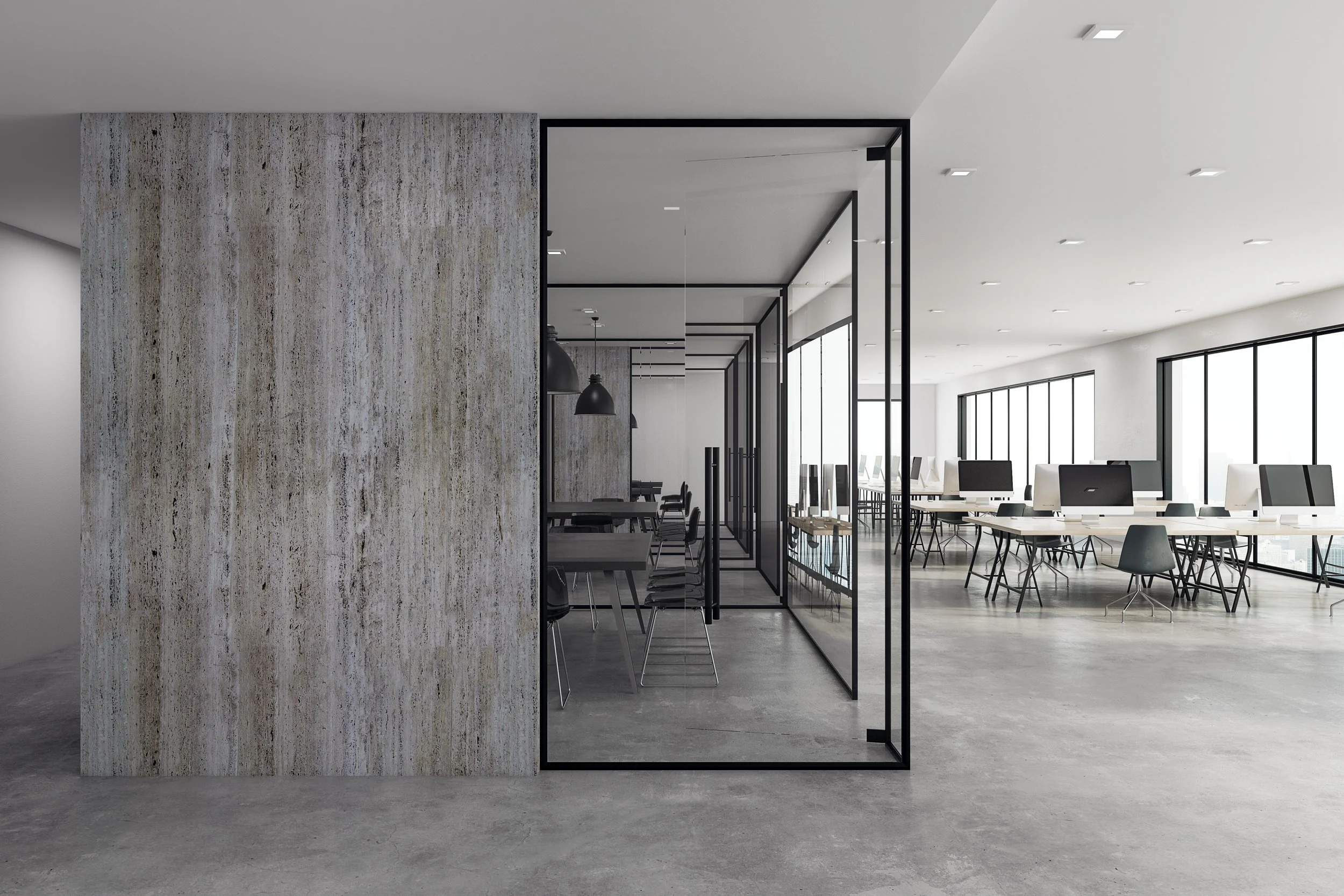 Modern office space with open workspace, large windows, and glass partitioned meeting room.