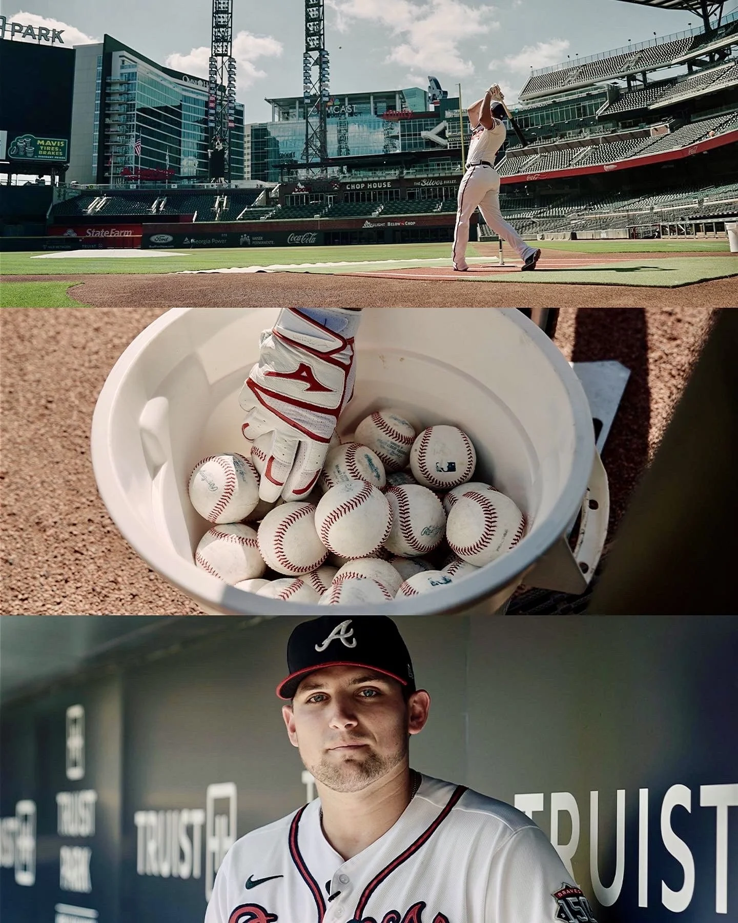 A baseball player in a white Atlanta Braves jersey and black cap stands in front of a wall with motivational words. The image appears to be taken inside a sports stadium, with the player looking directly at the camera.
