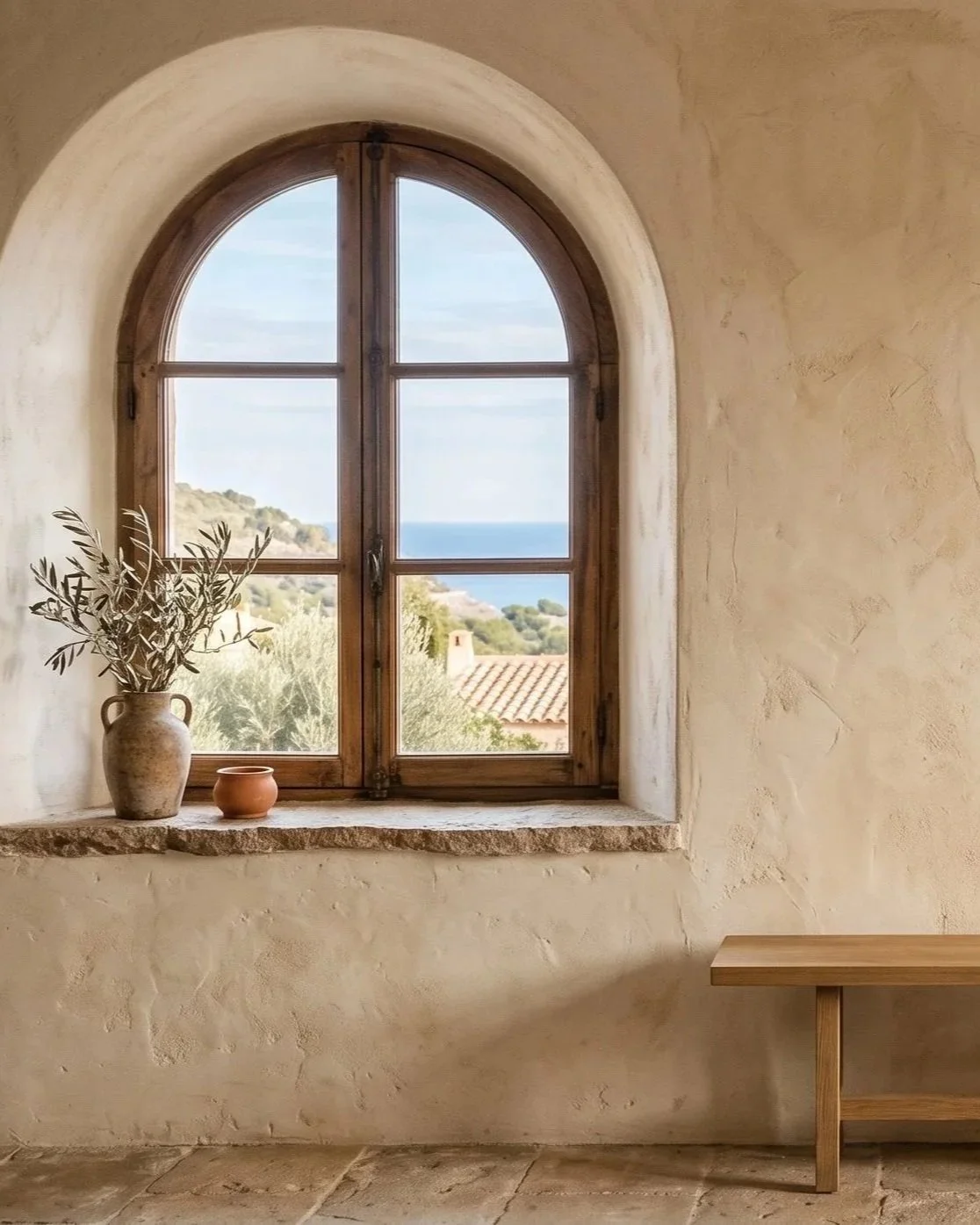A view through a wooden arched window representing individual and relational growth through the coaching process. Differentiation, strong relational connections, and calm knowing exist within the supported coaching space.