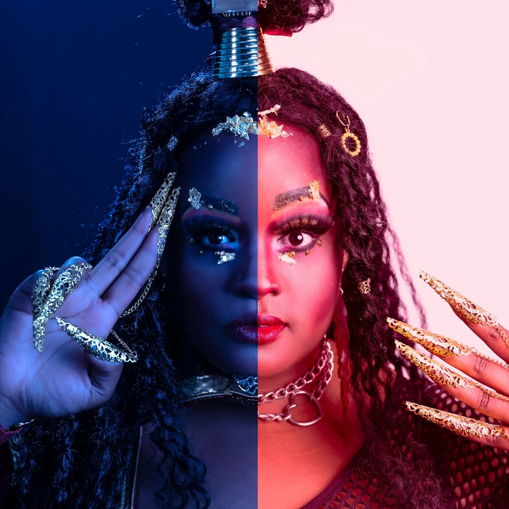 Professional Portrait Photography by Minneapolis Photographer Jay Cupcake. A woman with  half her face illuminated with blue light and the other half with pink light, wearing multiple rings, earrings, jewelry, with styled curly hair, and makeup.