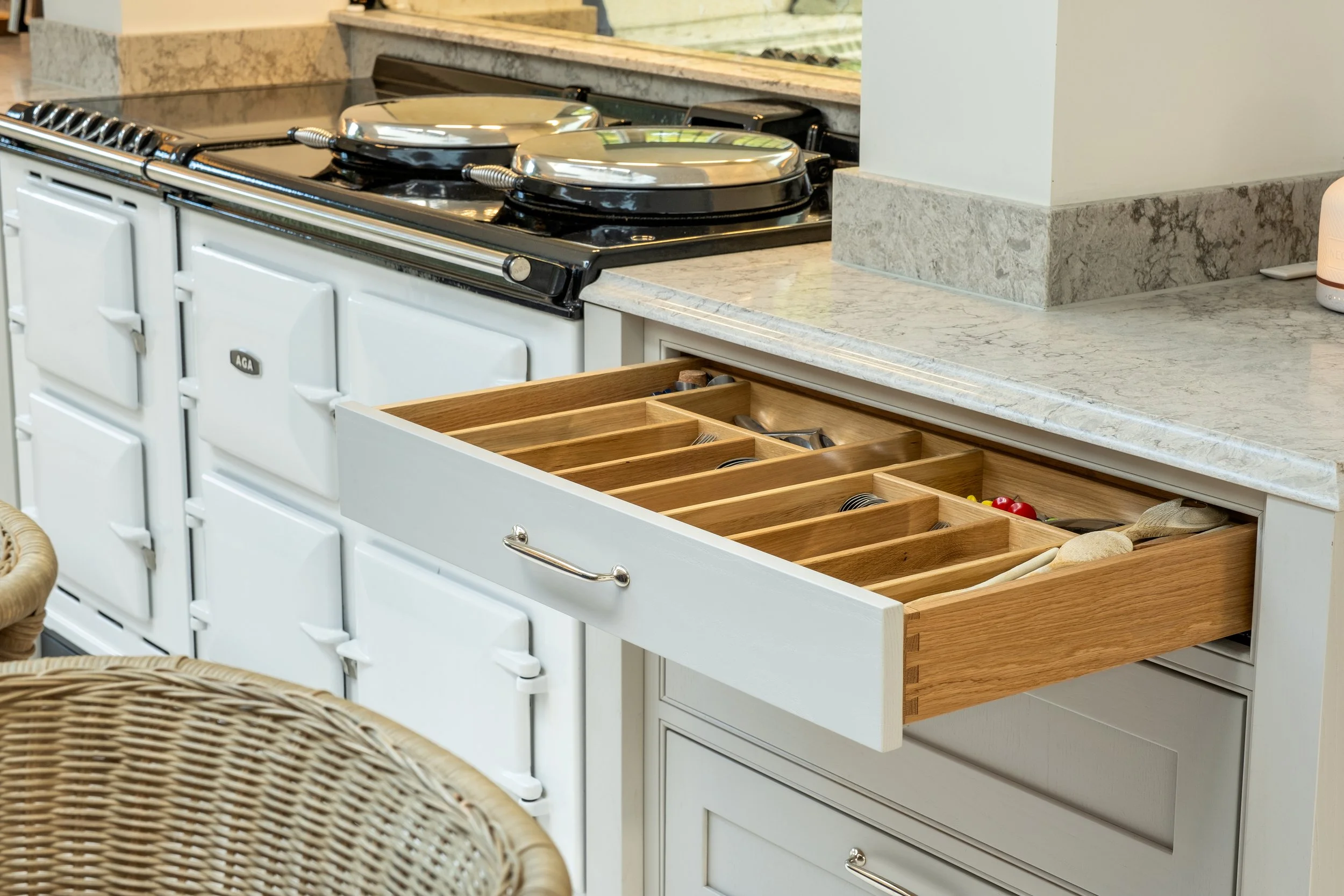 Handcrafted in-frame Shaker kitchen drawer detail alongside AGA range cooker, Fauld Manor, Staffordshire, by Portree Kitchens