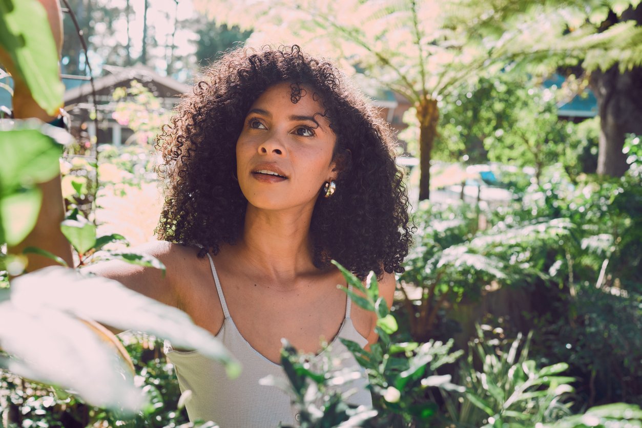 A Black woman with a calm, forward-looking expression, representing the shift that becomes possible through attachment-based therapy for relationship anxiety in New York and New Jersey.