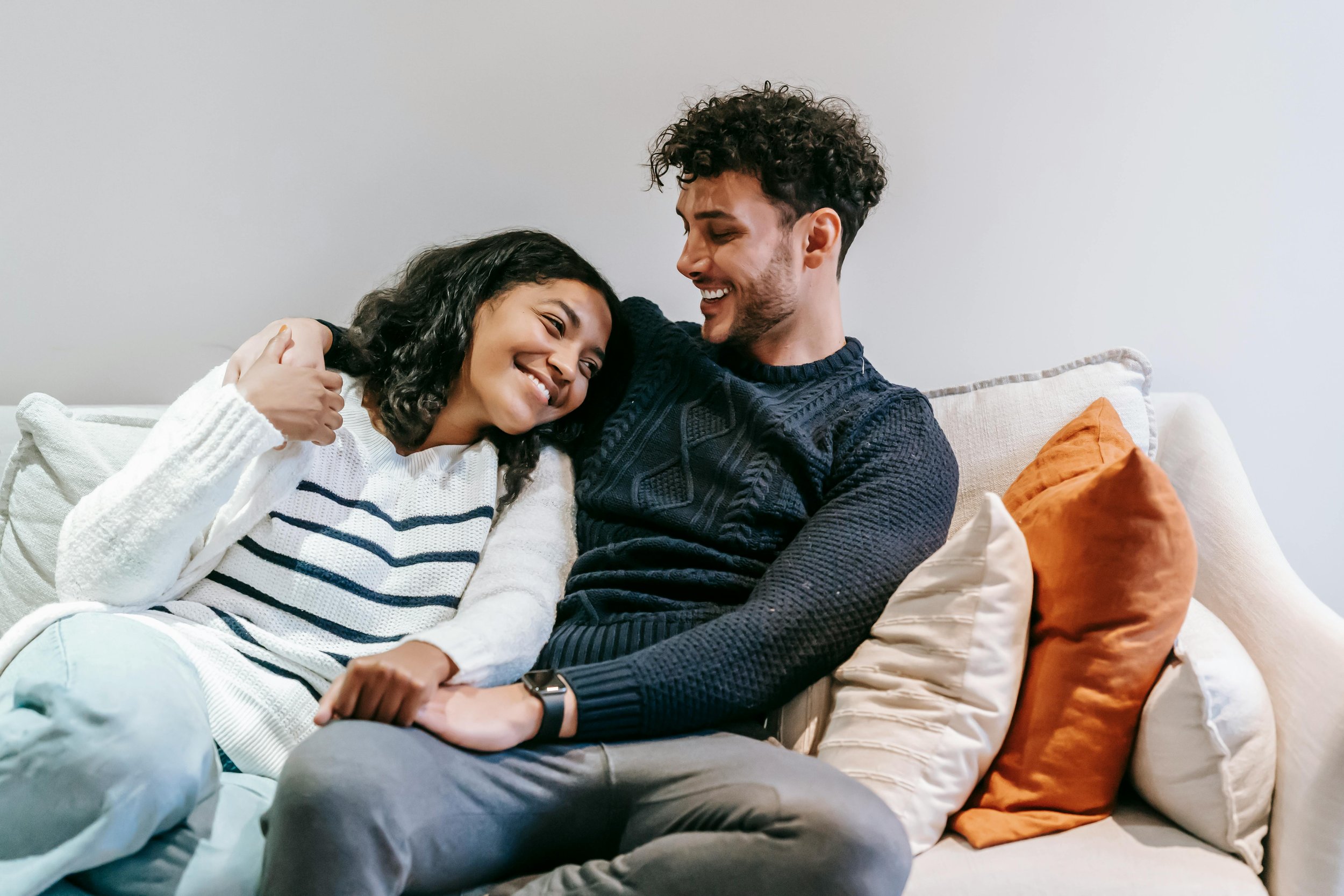 A couple sitting close together, reflecting the longing for connection and the anxiety that can accompany it.