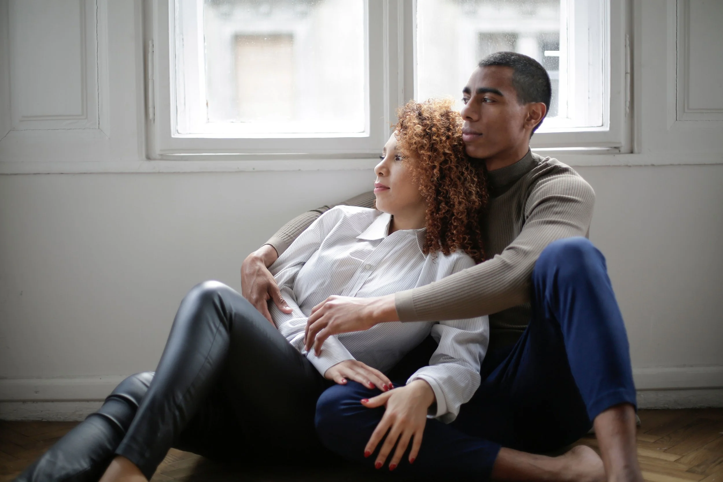 Two people in a quiet, comfortable moment together, representing the steady and undramatic quality of secure attachment that is often mistaken for lack of chemistry.