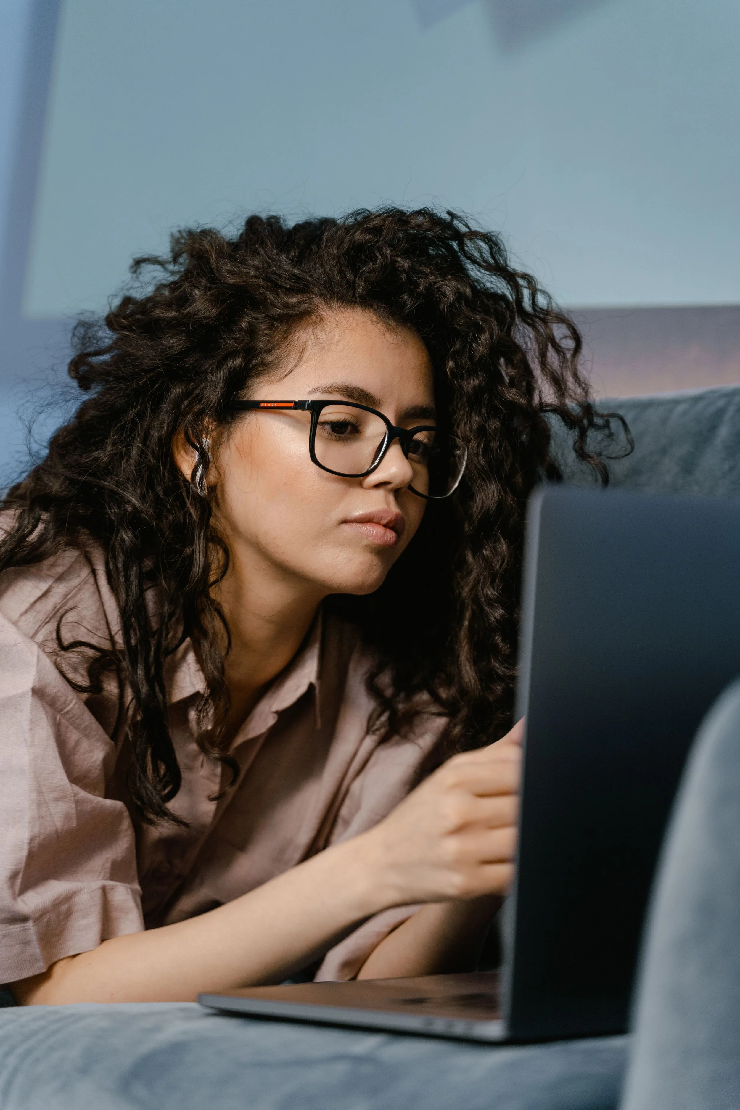 woman working late at a desk, representing the high-functioning anxiety pattern where productivity masks persistent internal pressure and exhaustion.