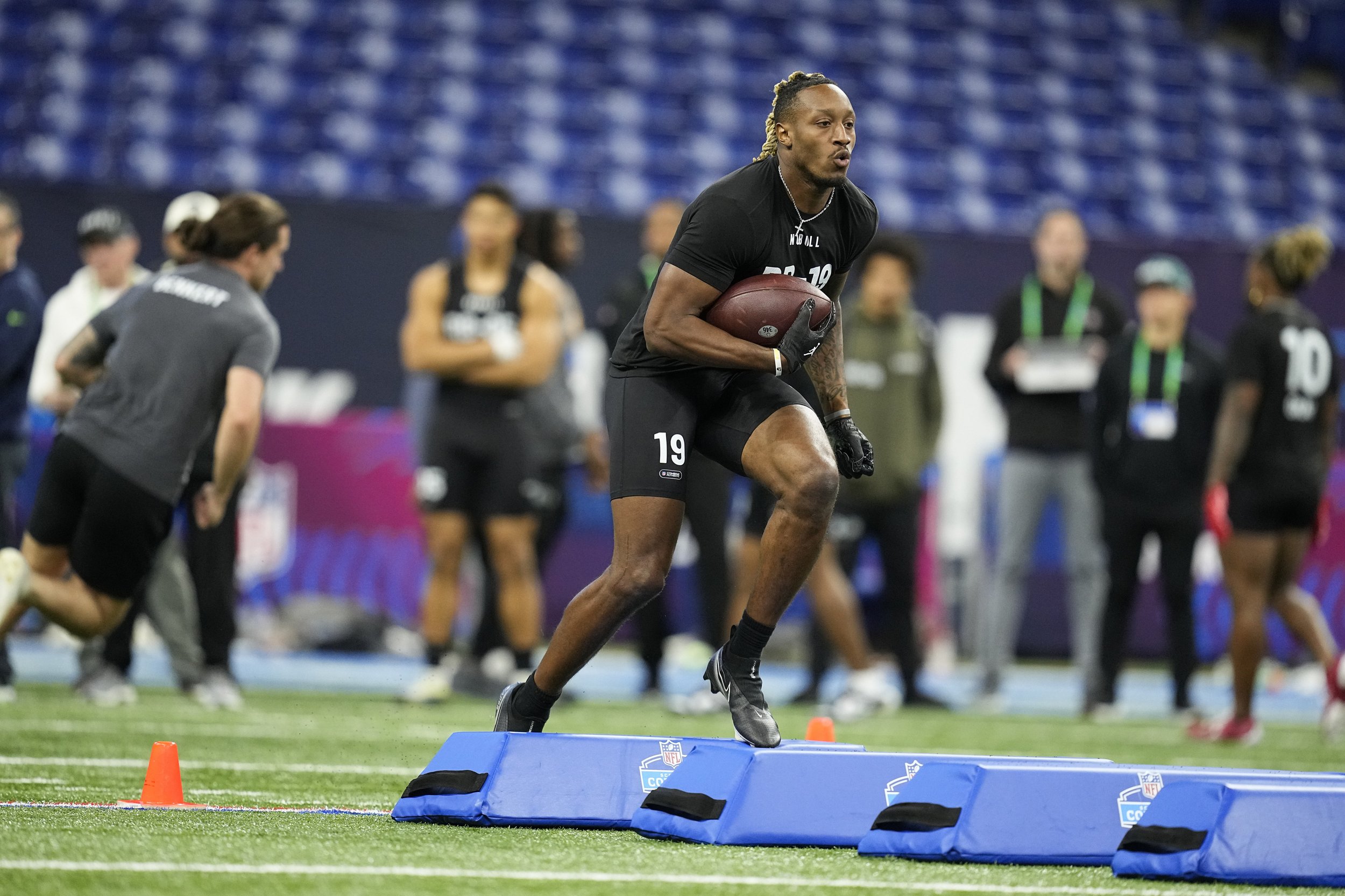 Cam Peoples during the 2023 NFL Scouting Combine preforming drills.