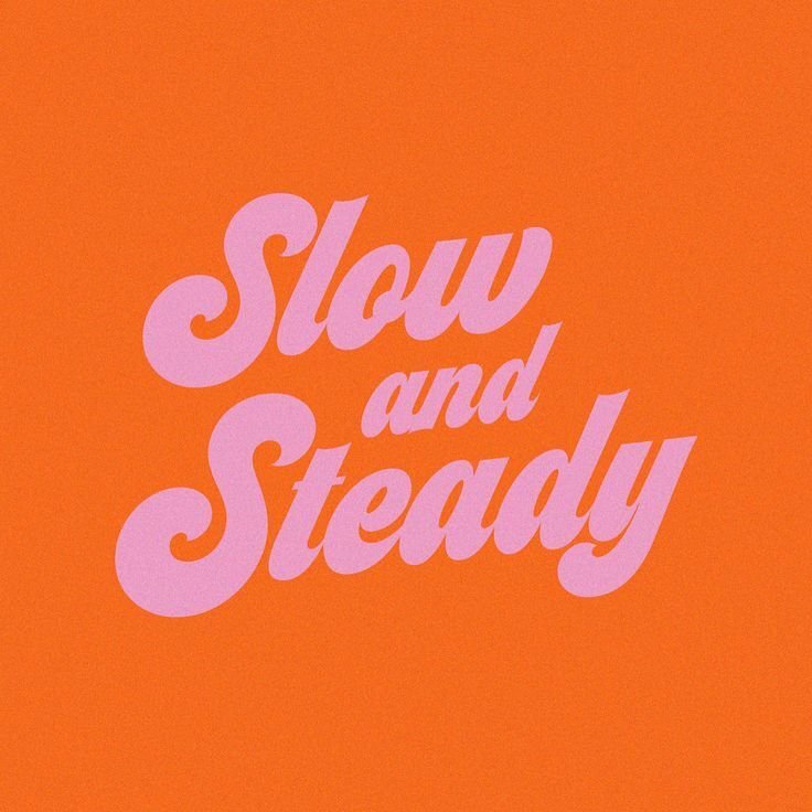 Orange background with the phrase "Slow and Steady" in large, pink, cursive letters.