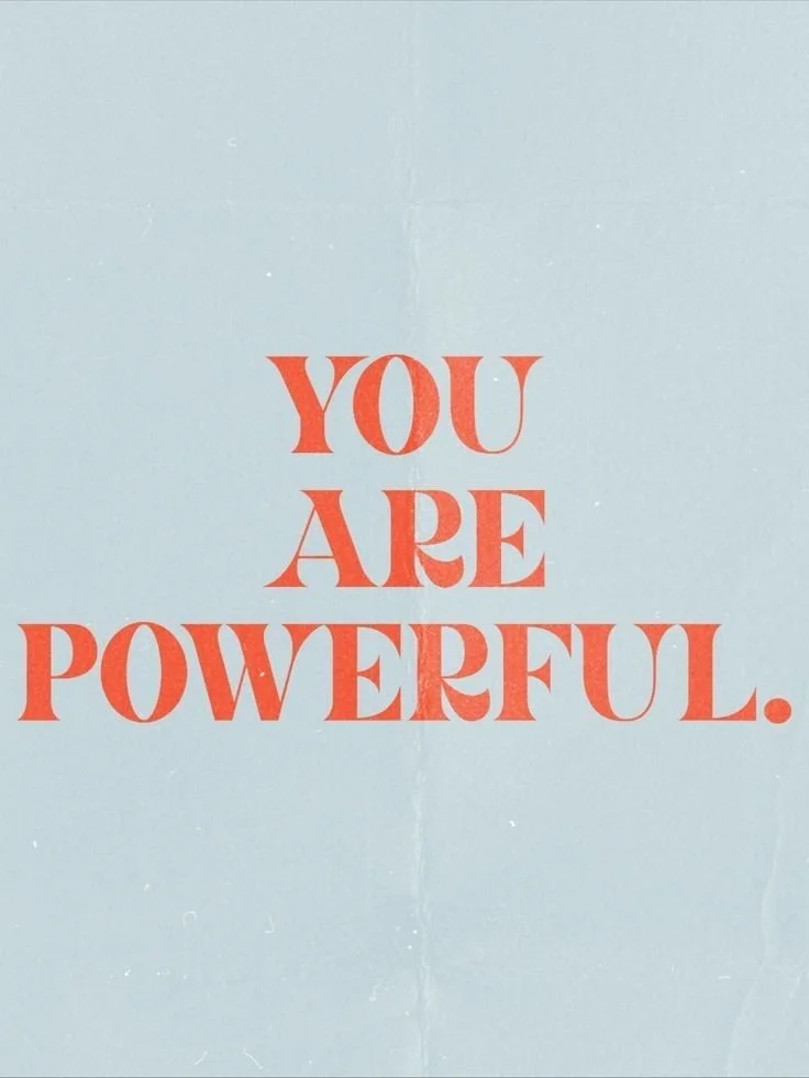A light blue wall with red text that says, "YOU ARE POWERFUL."