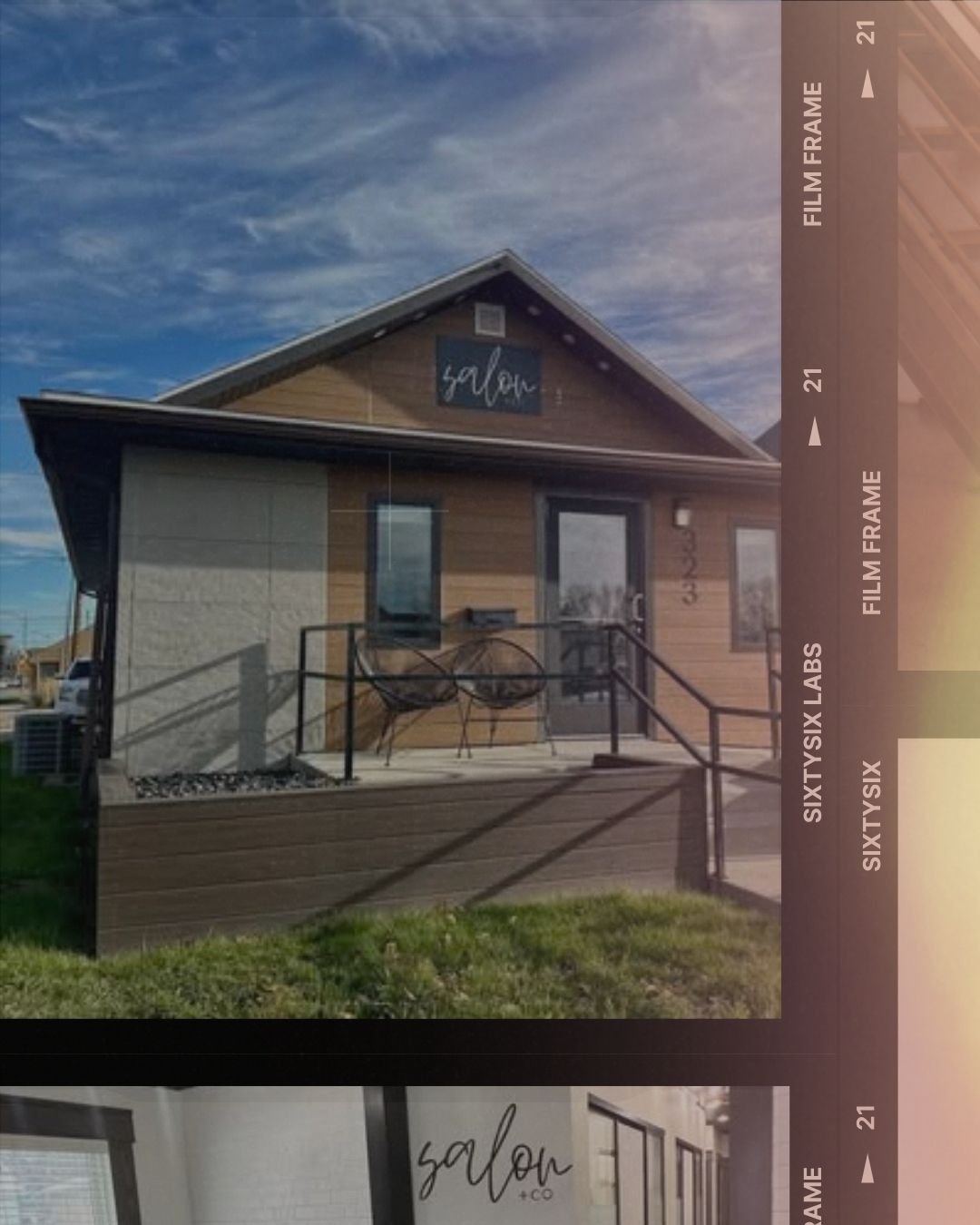 Exterior of a small modern house with a porch, two black chairs, a grass lawn, and a clear sky overhead.