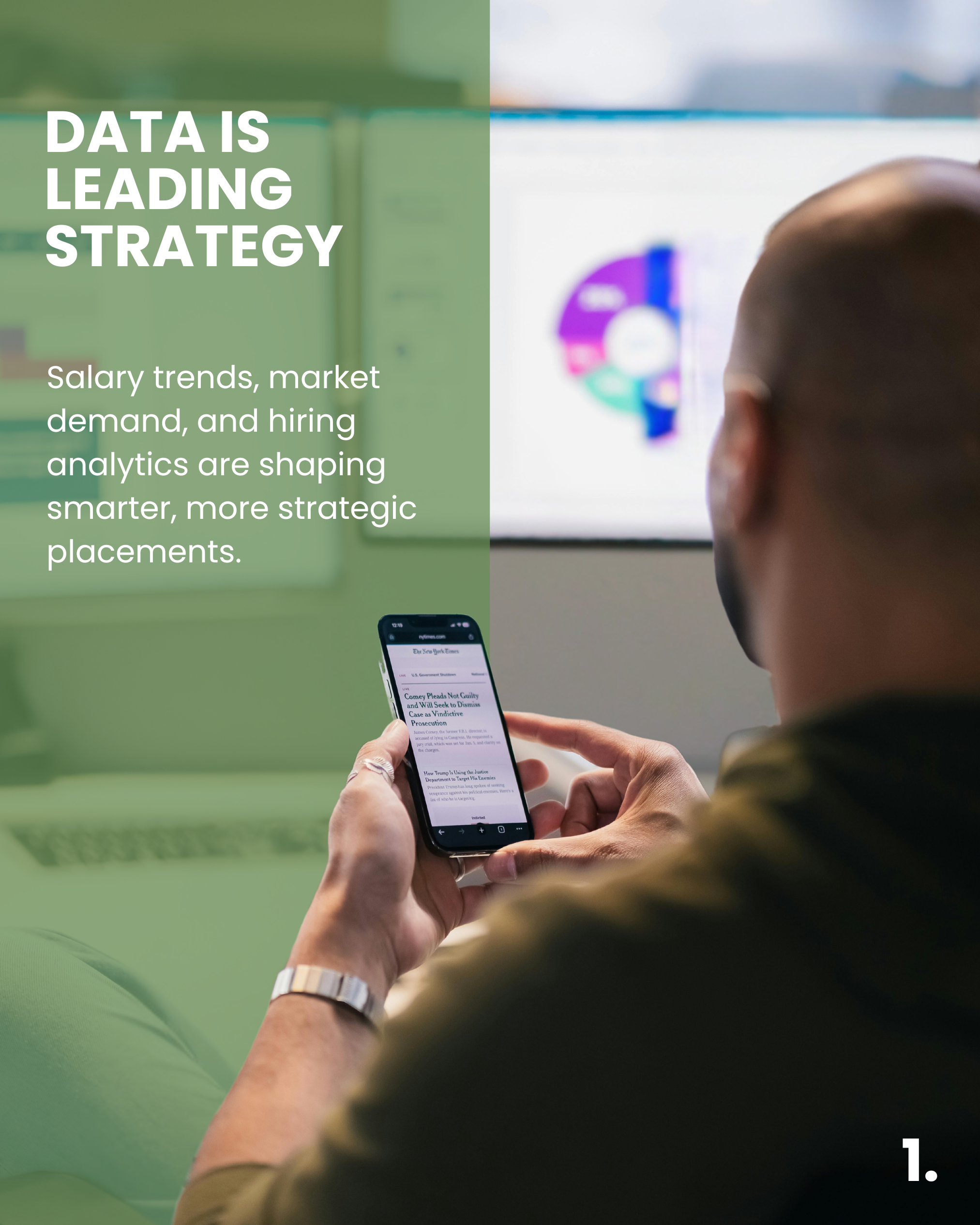 A person using a smartphone with a news headline displayed, sitting in front of a computer screen showing a colored pie chart, in an office setting.