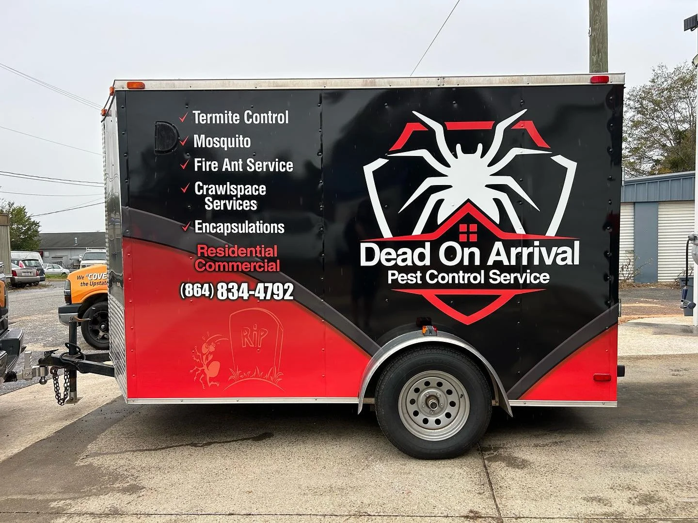 Black and red pest control service trailer with a large spider graphic, company name 'Dead On Arrival Pest Control Service,' and list of services like termite control, mosquito, fire ant service, crawlspace services, and encapsulations.
