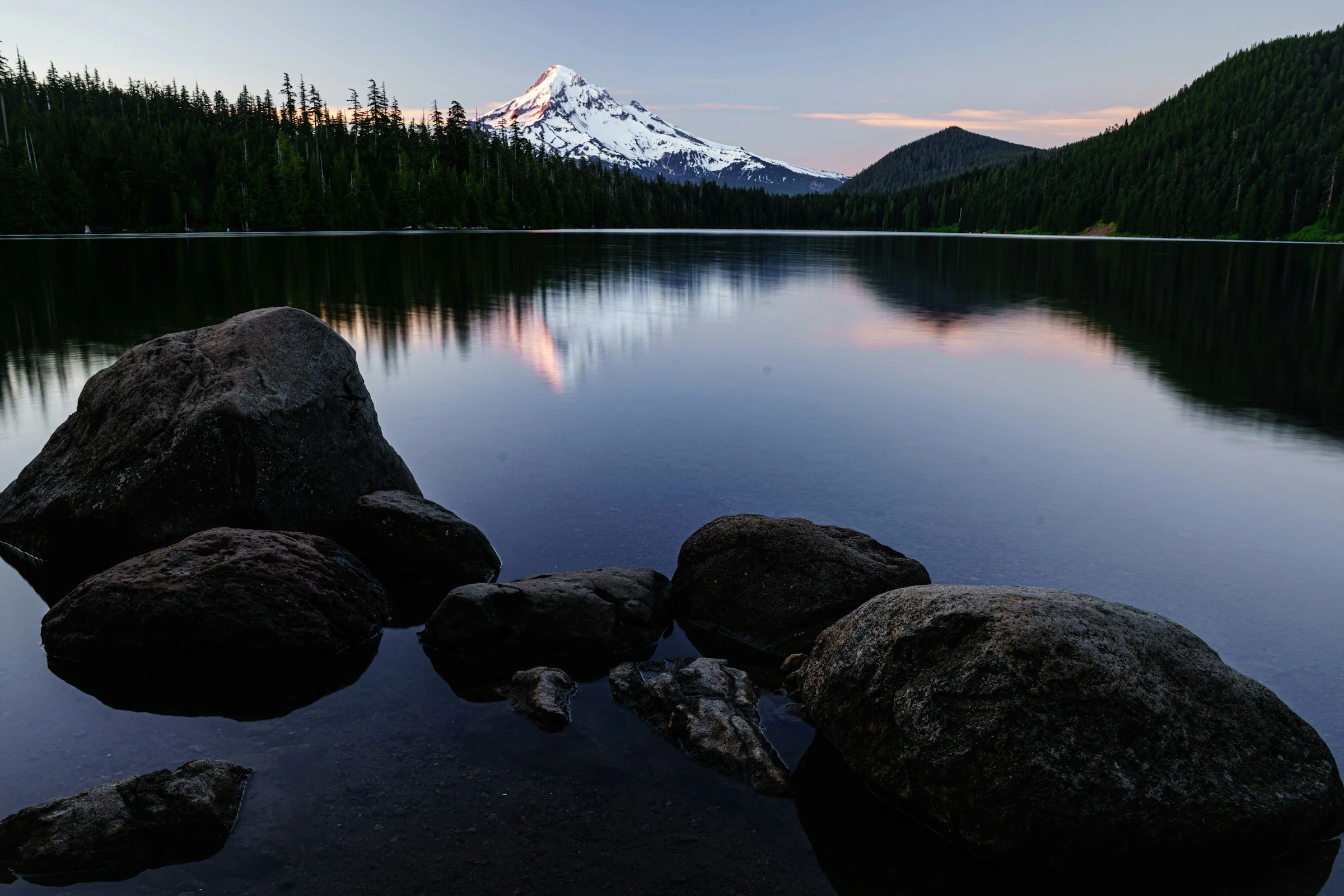 Reflections on a mountain lake at dusk