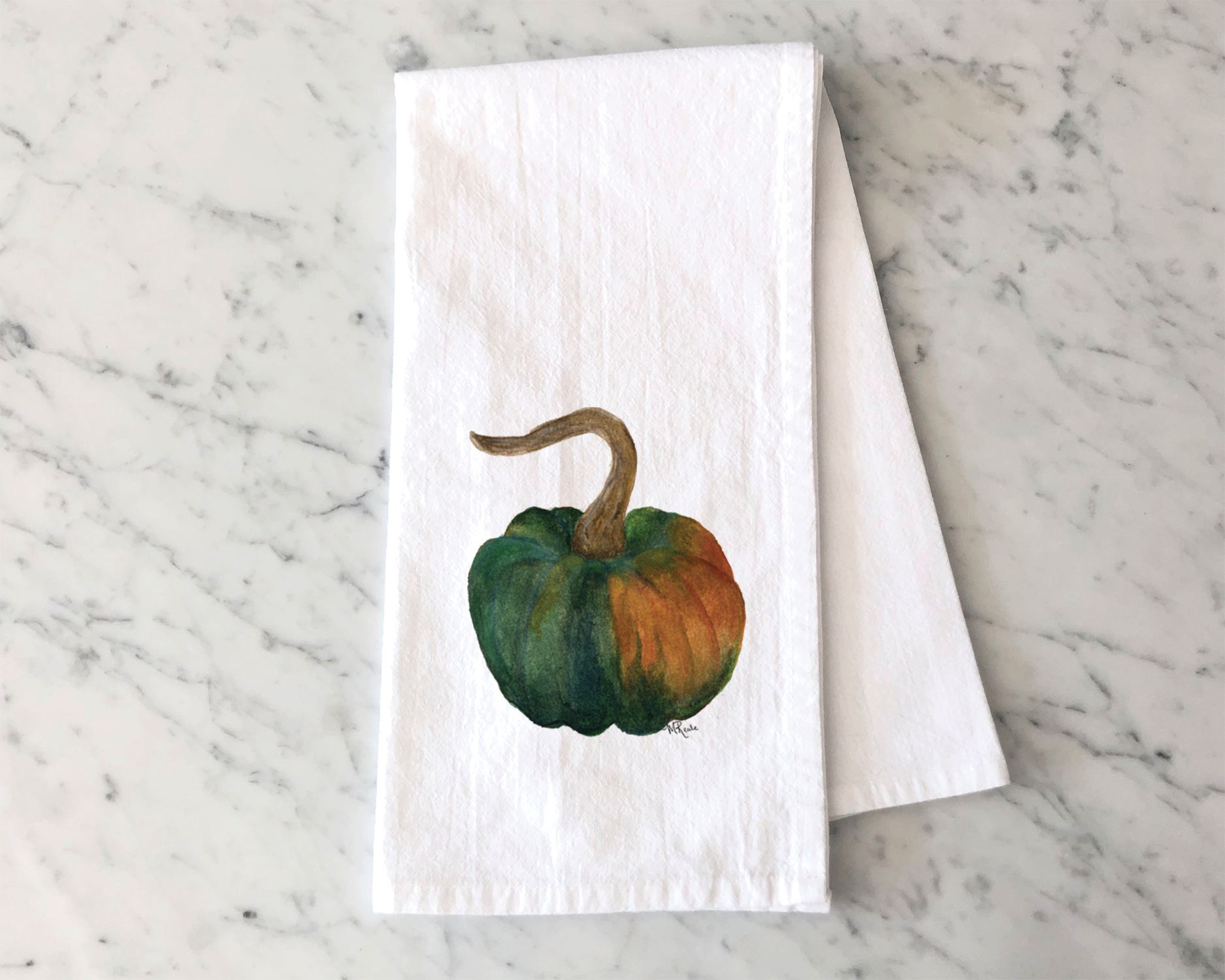 Watercolor painting of a small pumpkin with shades of orange, green, and brown, on a white textured paper napkin placed on a marble surface.