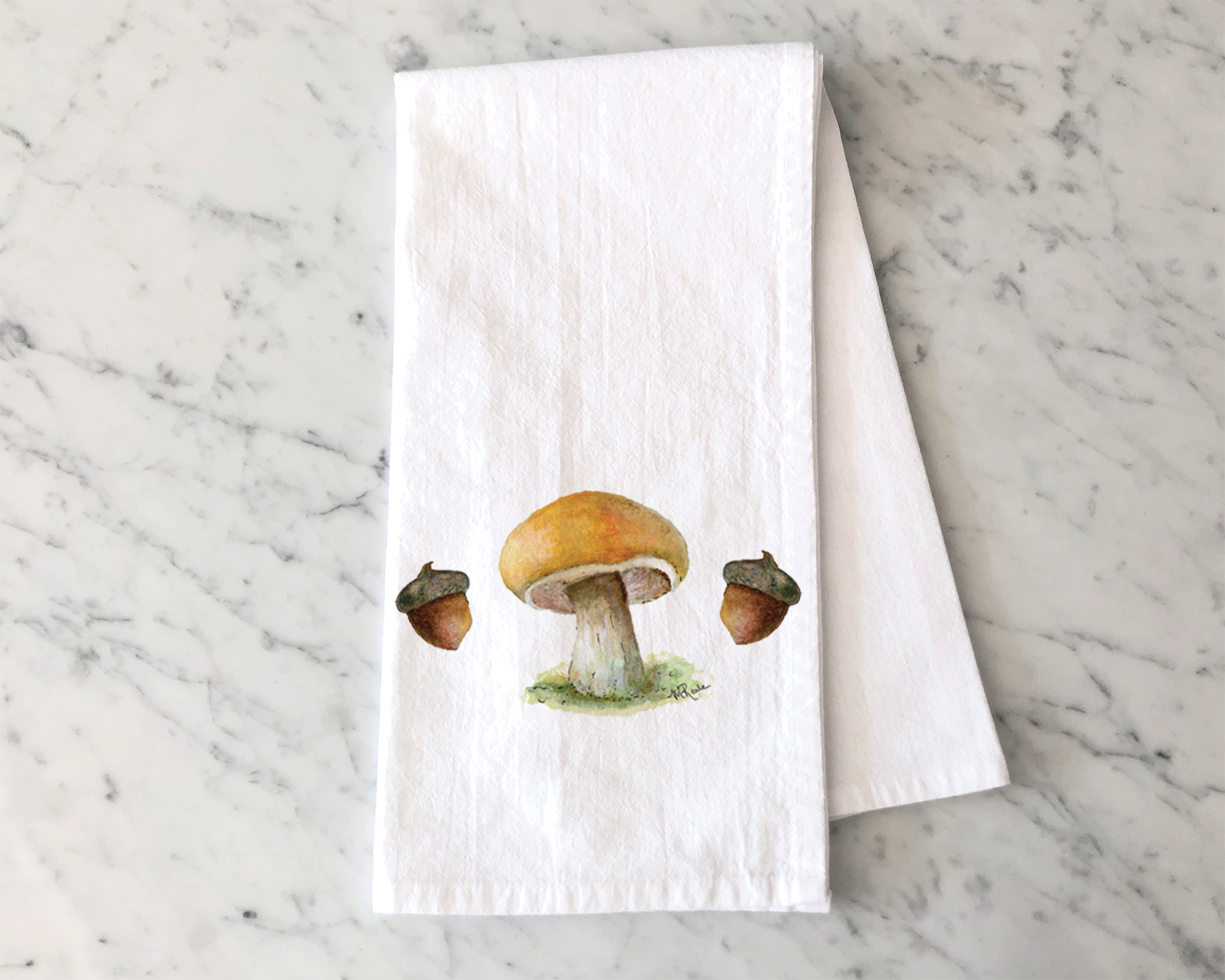 A paper towel with a watercolor illustration of a mushroom on it, placed on a white marble surface.