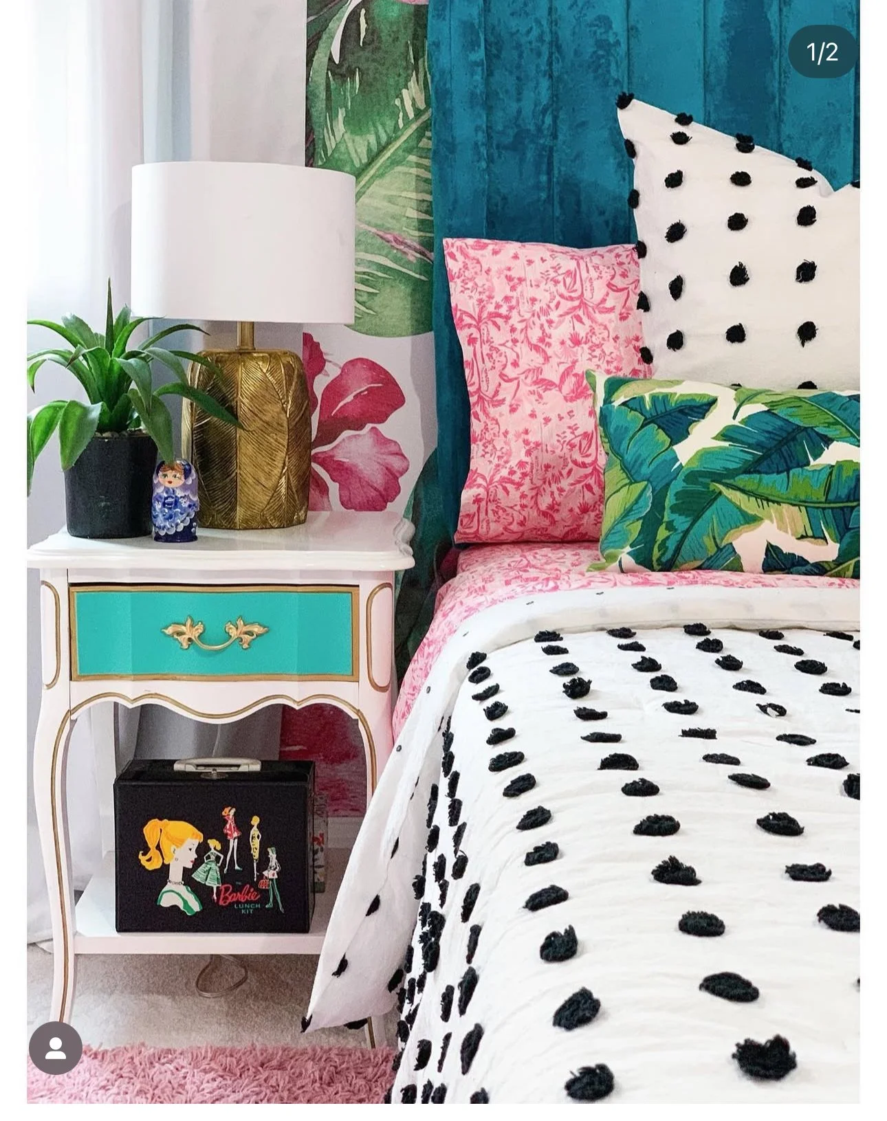 Barbie-inspired bedroom design Palm Springs style featuring bold pink textiles, palm print accents, layered patterns and eclectic nightstand styling by Melissa B. Rodgers Kansas City