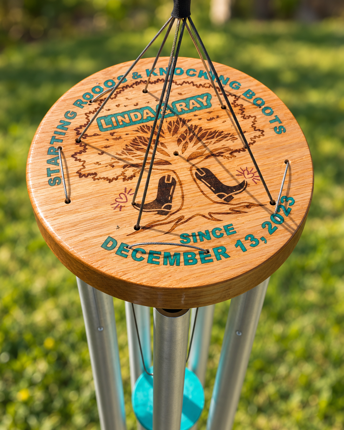Custom wedding wind chime with a hand-painted boots and tree topper and engraved sail