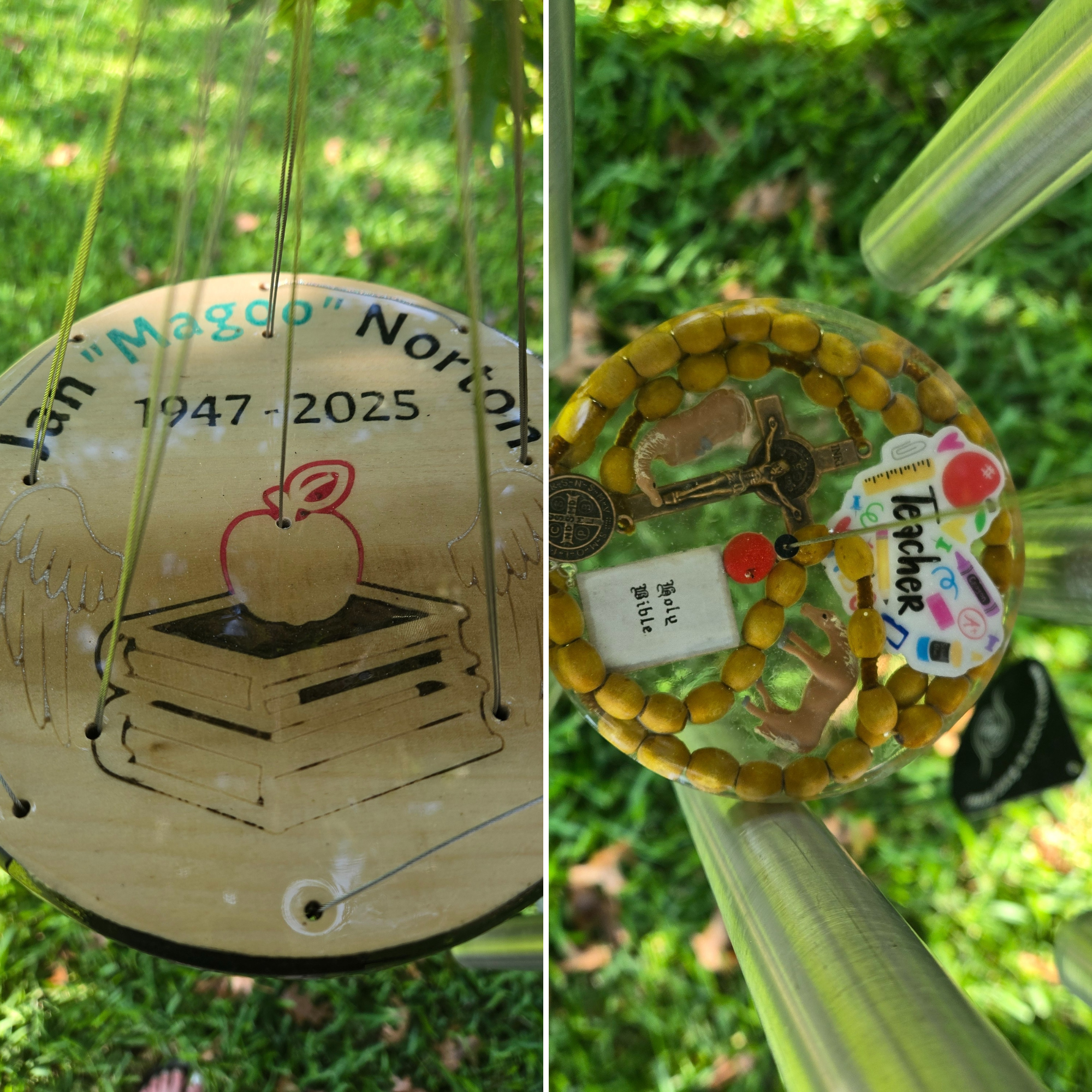 Close-up of a commemorative plaque and decorative items on a memorial structure outdoors, with green grass in the background.