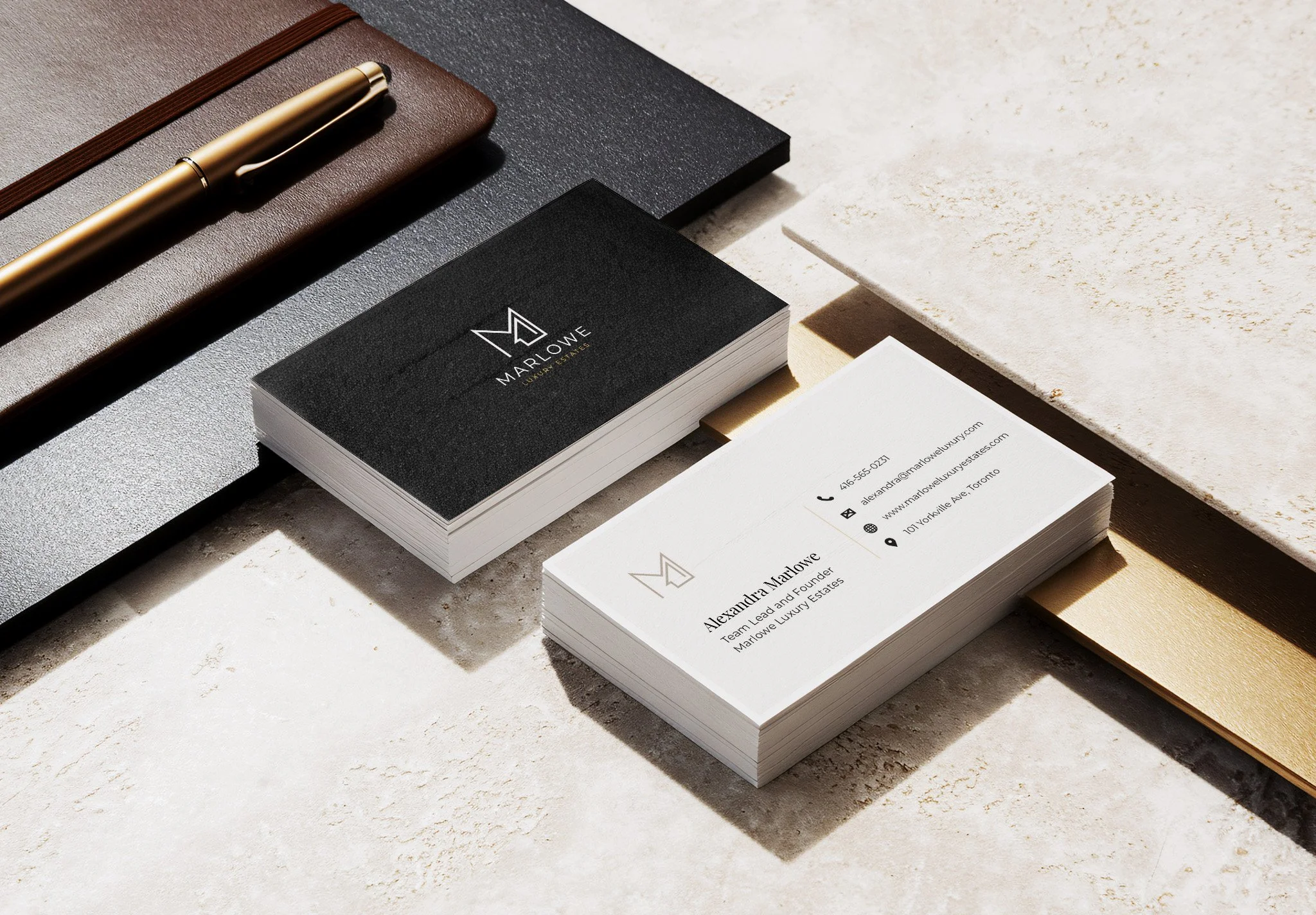 Luxury business cards stacked front and back on a premium background with leather portfolio and gold pen