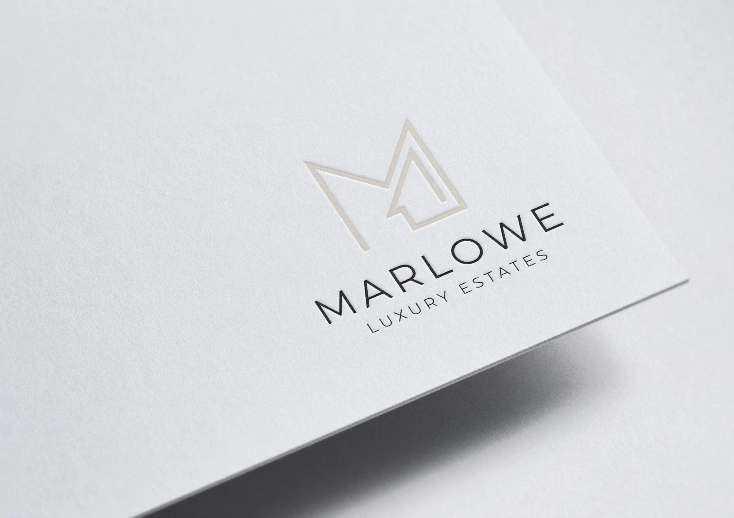Luxury real estate logo mockup on paper