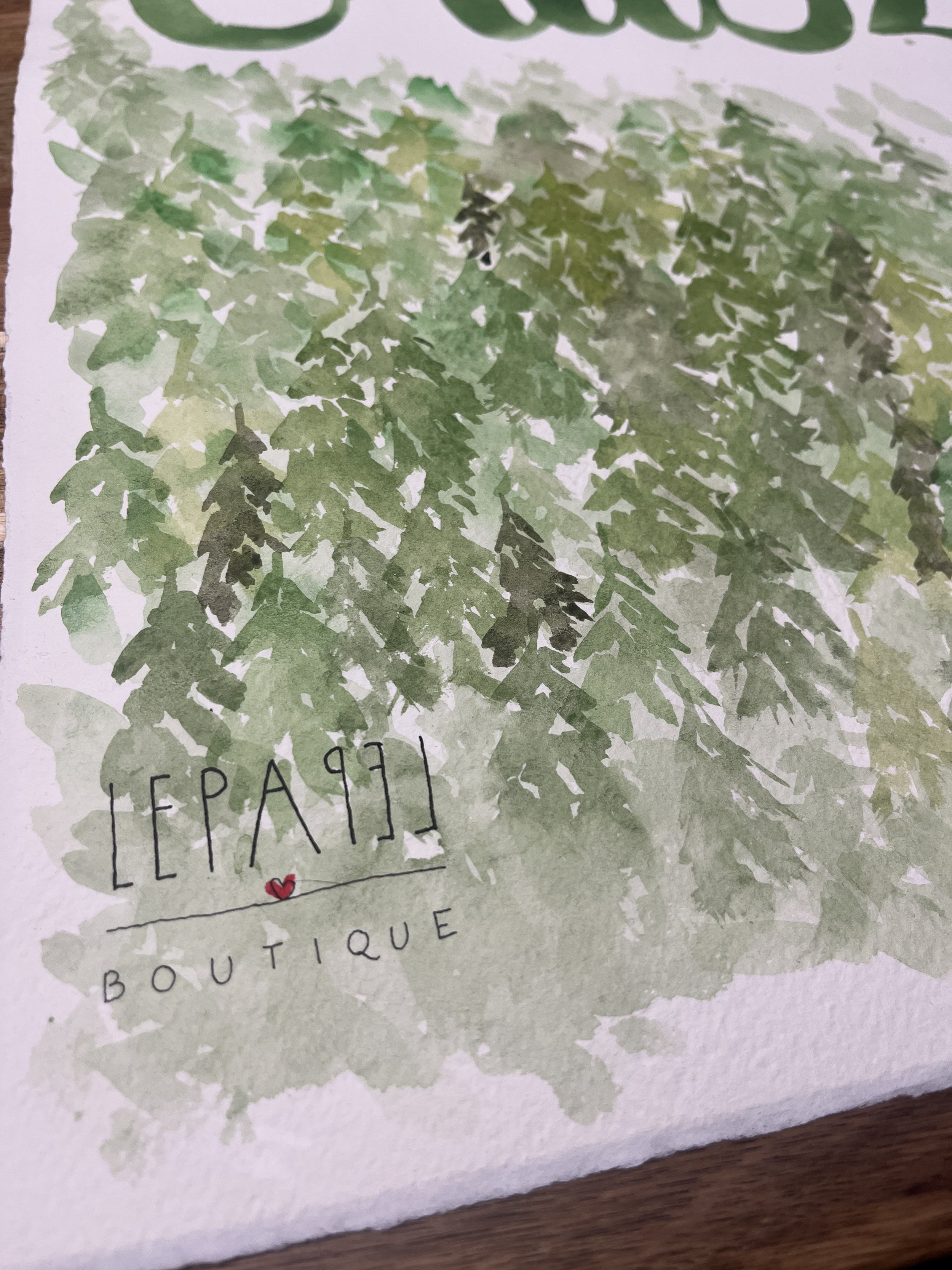 Detalle de acuarela en ilustración personalizada de casa, con pinceladas manuales y firma artesanal