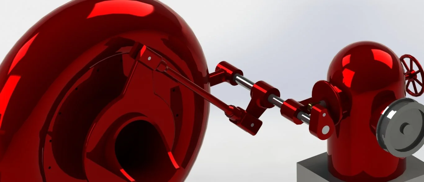 Imagen de un gobernador antiguo de turbina Francis con componentes metálicos rojos y un volante en un fondo gris claro.