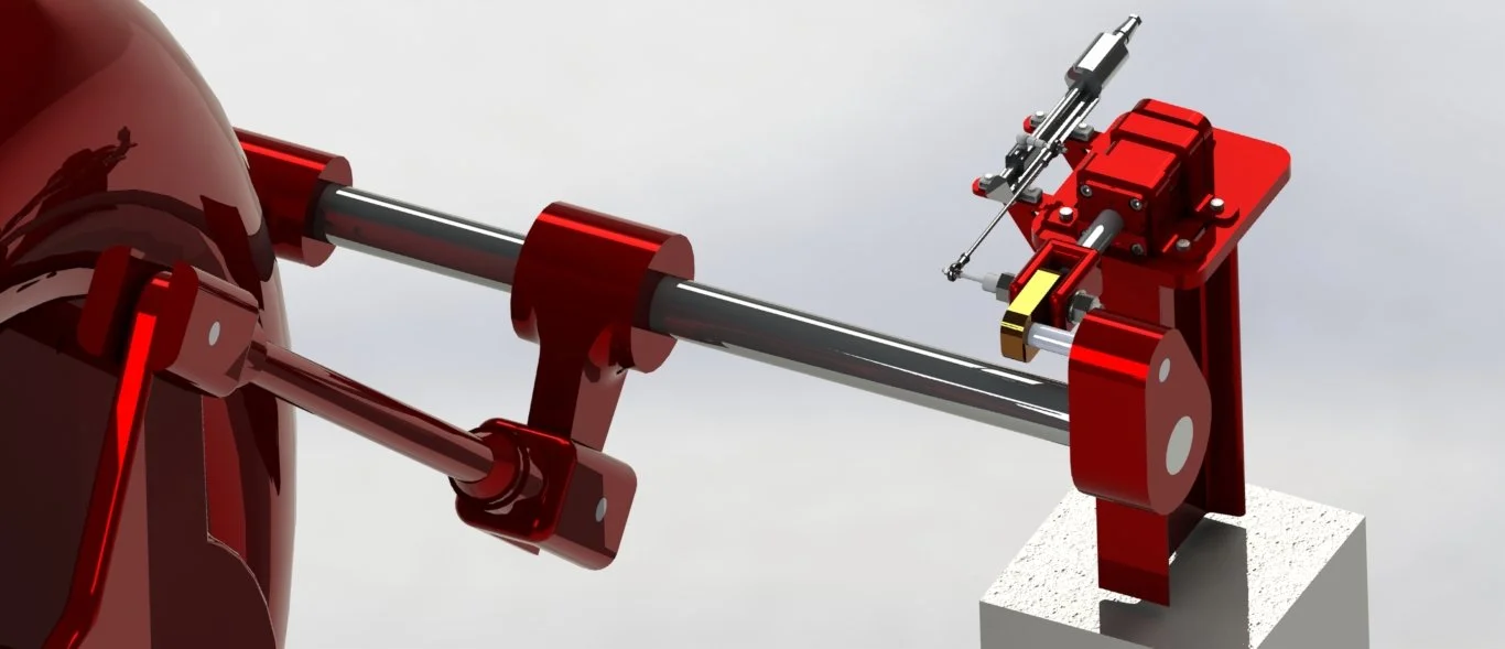 Modelo de un retroffiting de un gobernador de turbina Francis, con partes metálicas rojas y negras.
