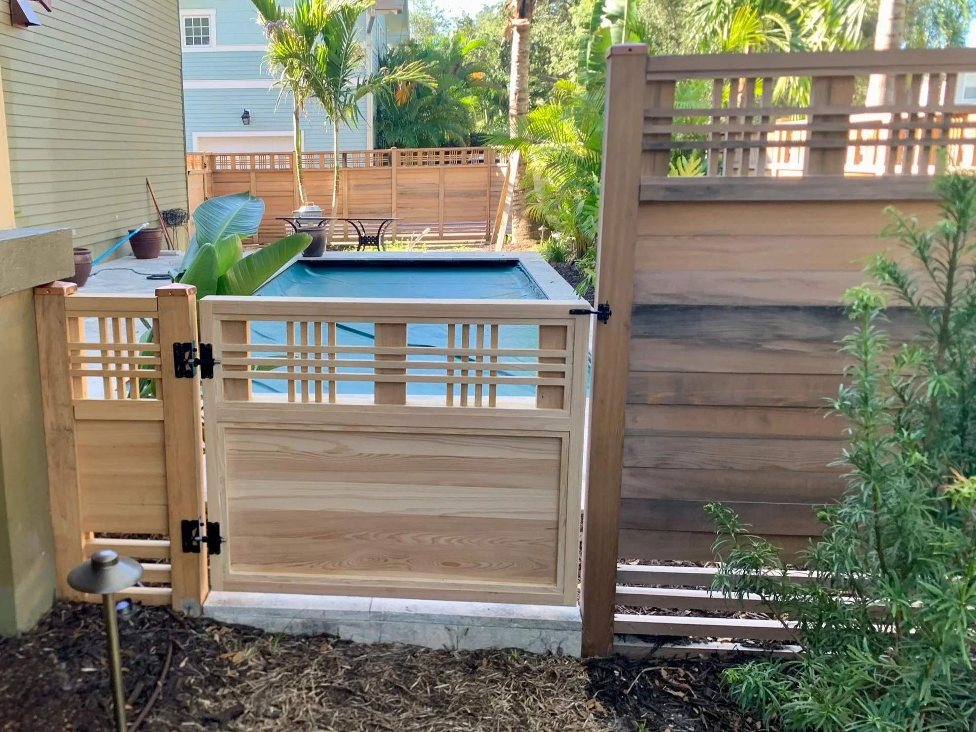 CUSTOM CYPRESS GATE, St. Pete, FL | Designed to coordinate with a cypress fence in the Historic Old Northeast neighborhood - the lattice upper panel and solid lower panel create a timeless, architectural look that complements the home's character and