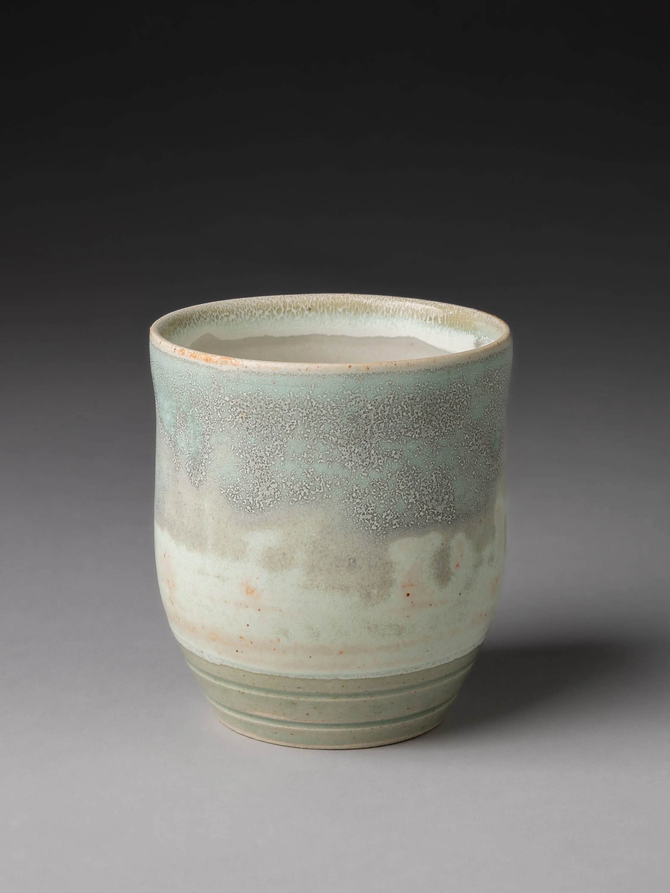 Studio photo of art craft ceramic cup on a clean background with natural light and high resolution detail