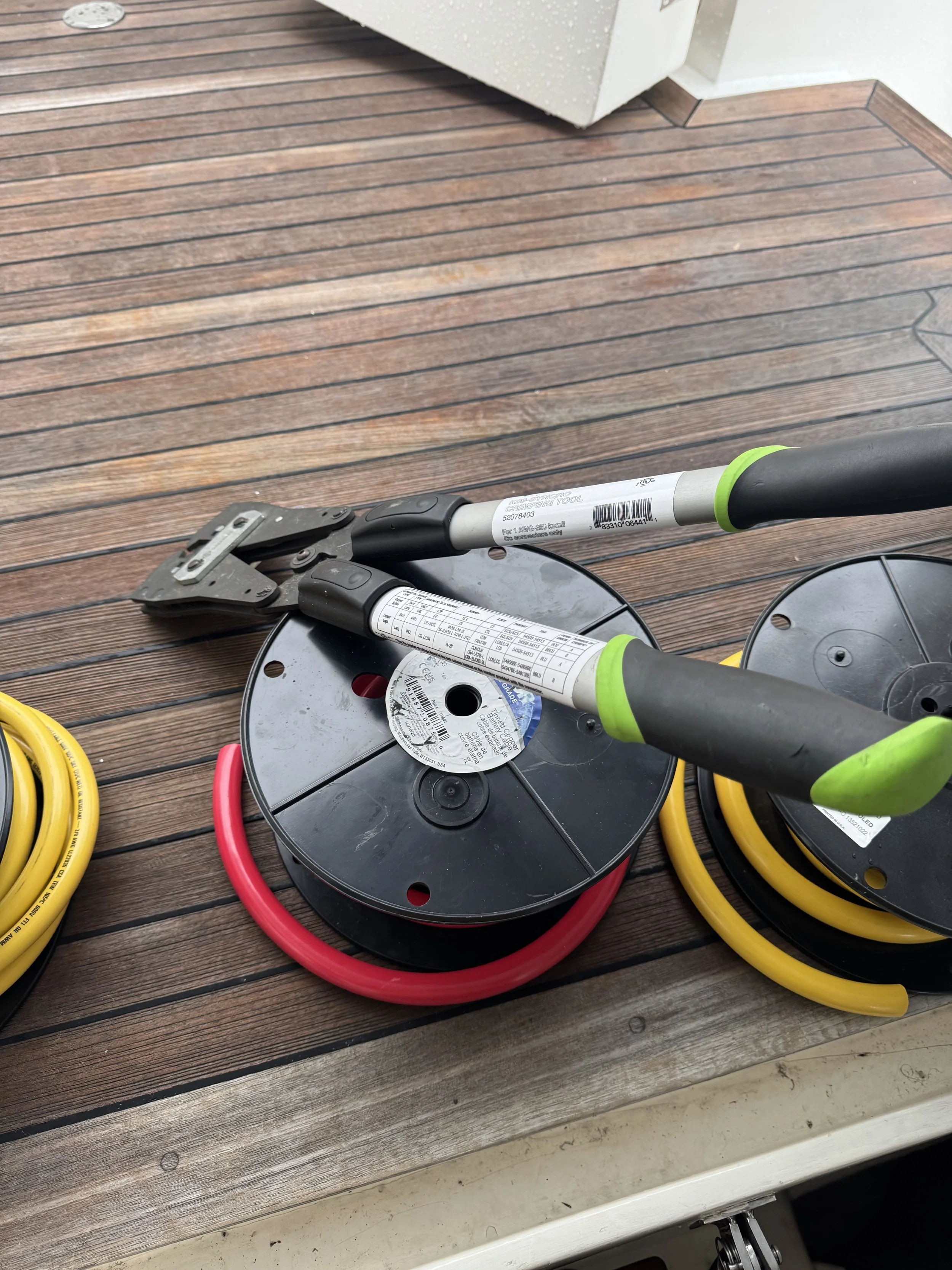 Tools of the trade for making reliable connections on battery cables on an install on a 46' Ocean Alexander yacht in Washington.