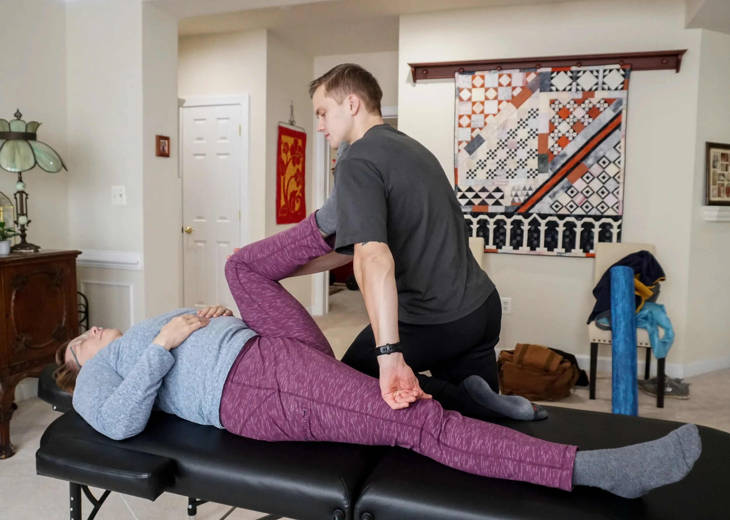 Assisted stretching session targeting lower back pain relief and spinal mobility