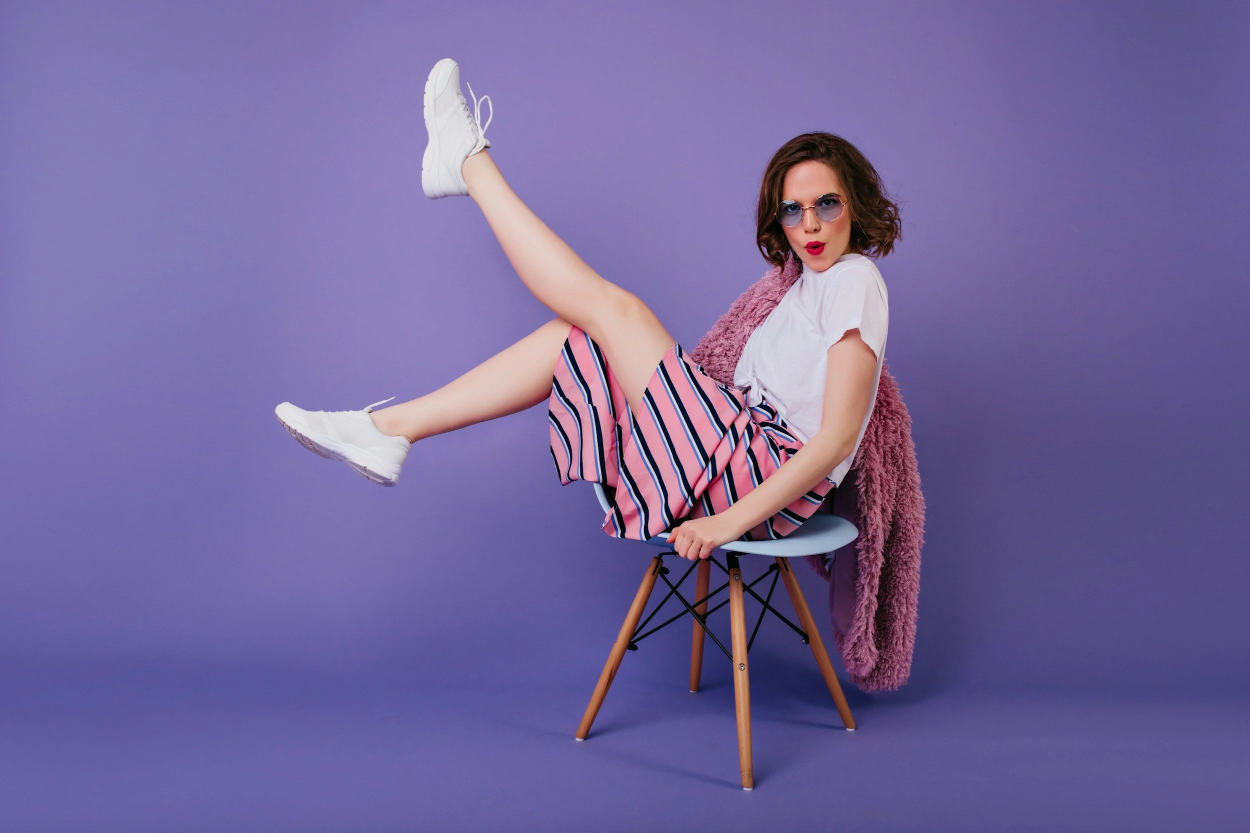 Woman sitting in chair looking crazy