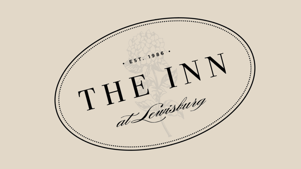 Framed Signature Mark:
A styled variation of the primary wordmark for specialty placements and heritage moments.