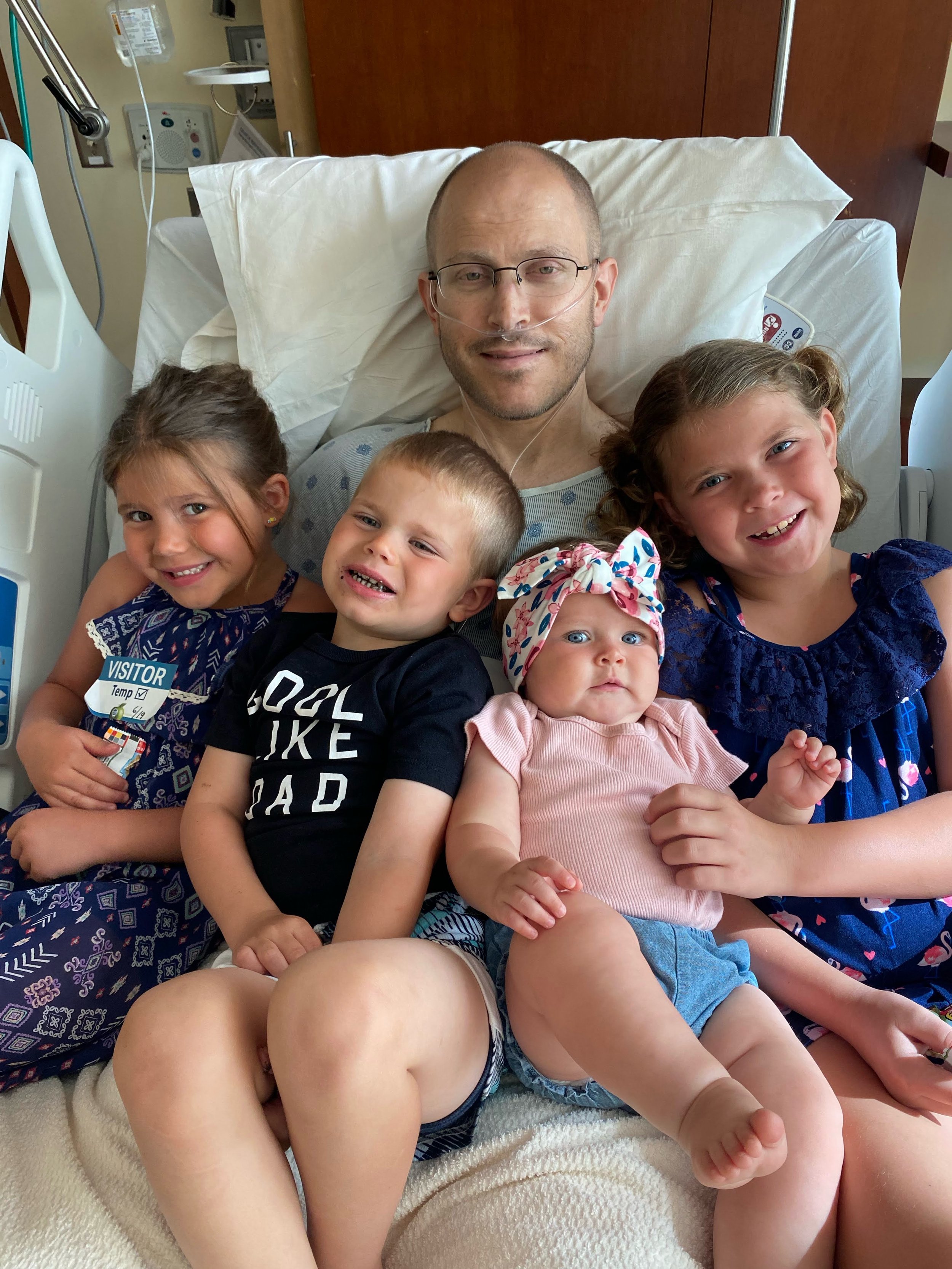 Neil Schnipke with his kids in the hospital