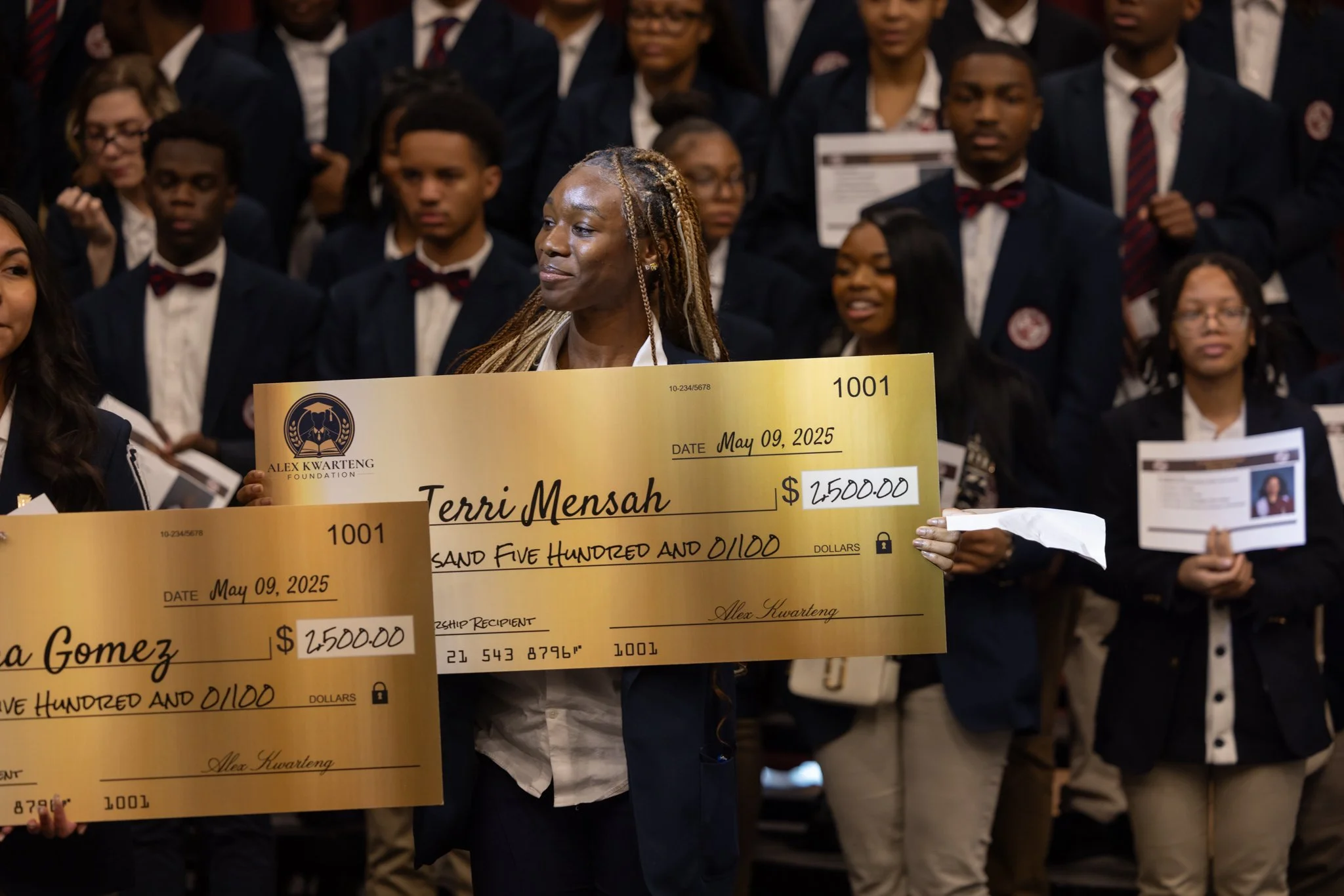 A scholarship recipient receiving funds from the Alex Kwarteng Foundation.