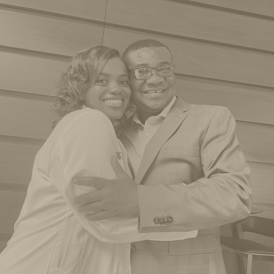 Esther Kwarteng, Foundation Co-founder and medical student, in academic graduation regalia with her father, Dr. Alex Kwarteng, at their family-led scholarship foundation.
