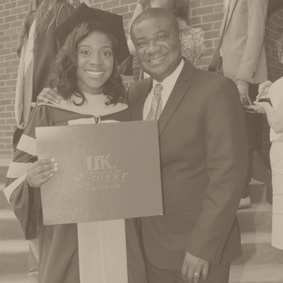 Lisa Kwarteng, Foundation Co-founder and orthodontist, in graduation regalia with her father, Dr. Alex Kwarteng, symbolizing a legacy of academic excellence.