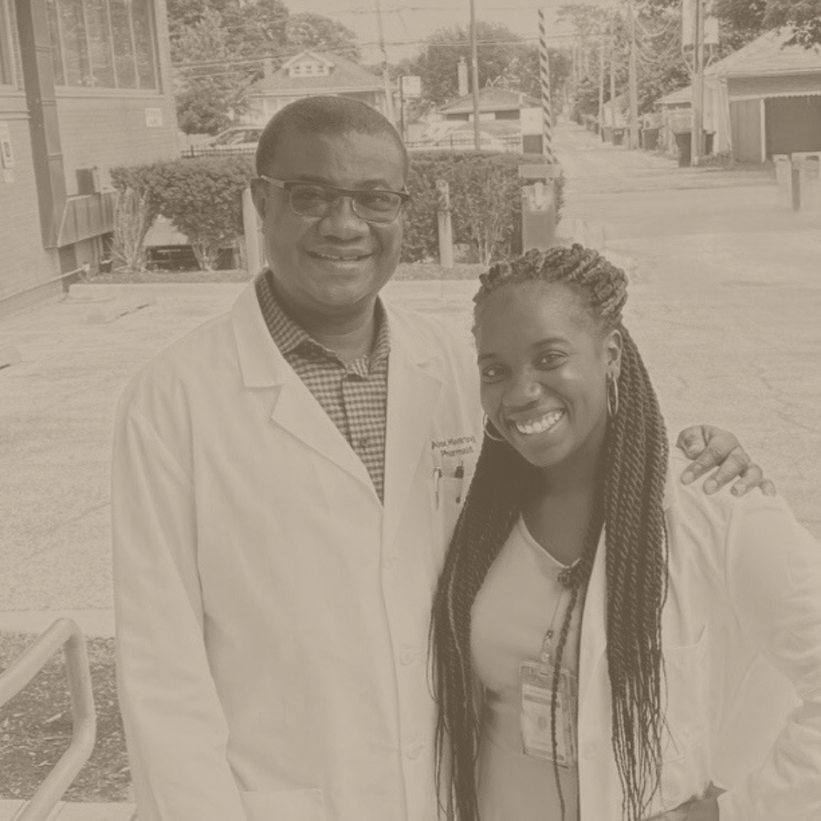Sandra Kwarteng, Foundation Co-founder and pharmacist, posing in graduation gown with her father, Dr. Alex Kwarteng, reflecting the family's commitment to higher education.