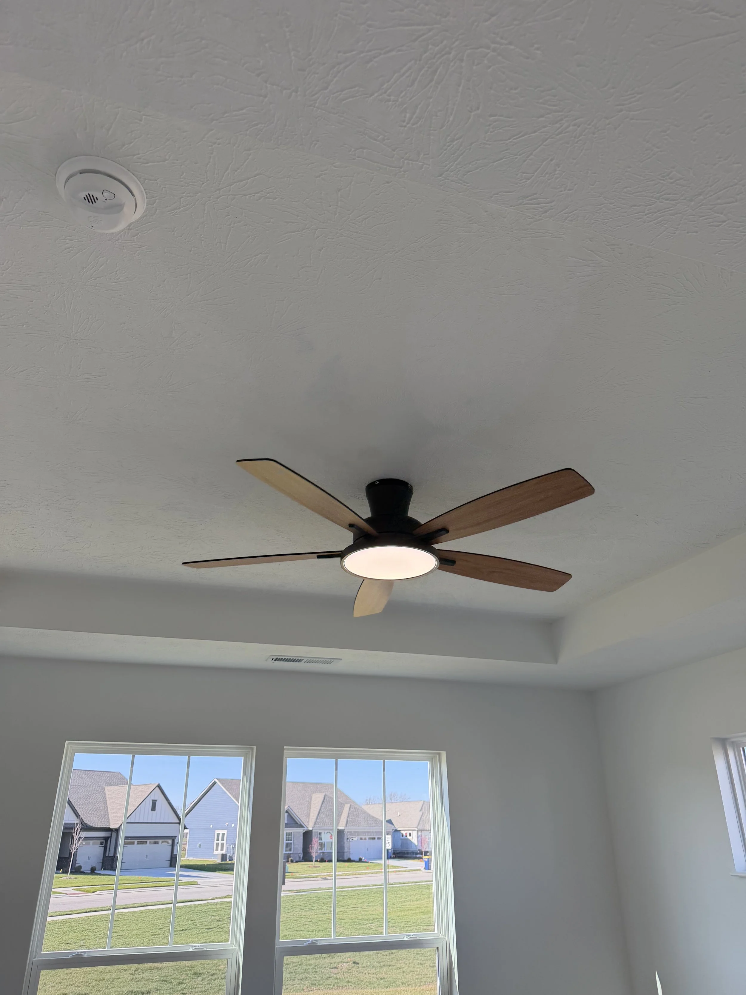 Detailed view of a wood-staining project for a bespoke entryway in Fishers.