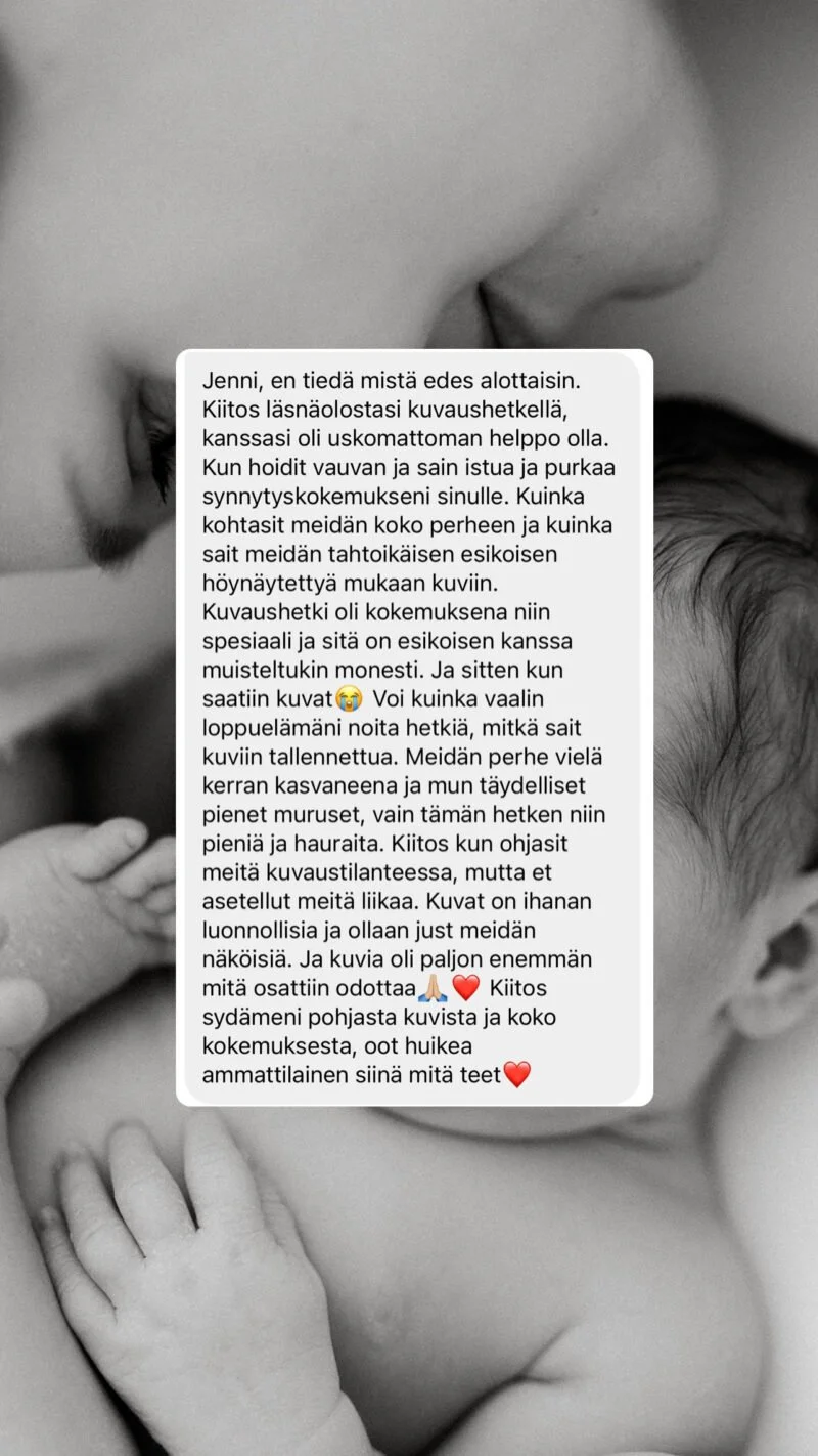 Close-up black-and-white photo of a mother tenderly kissing her baby, showing intimate and loving moment.