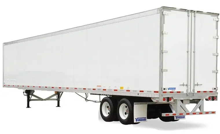 White semi-trailer truck with dual rear axles and a closed cargo container.